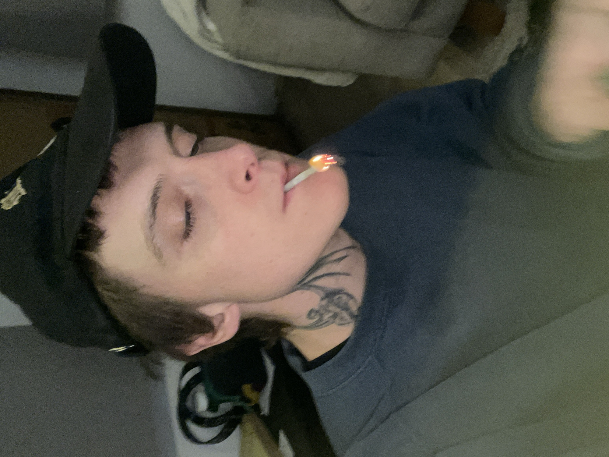 Man smoking marijuana indoors in La Lucila, Argentina