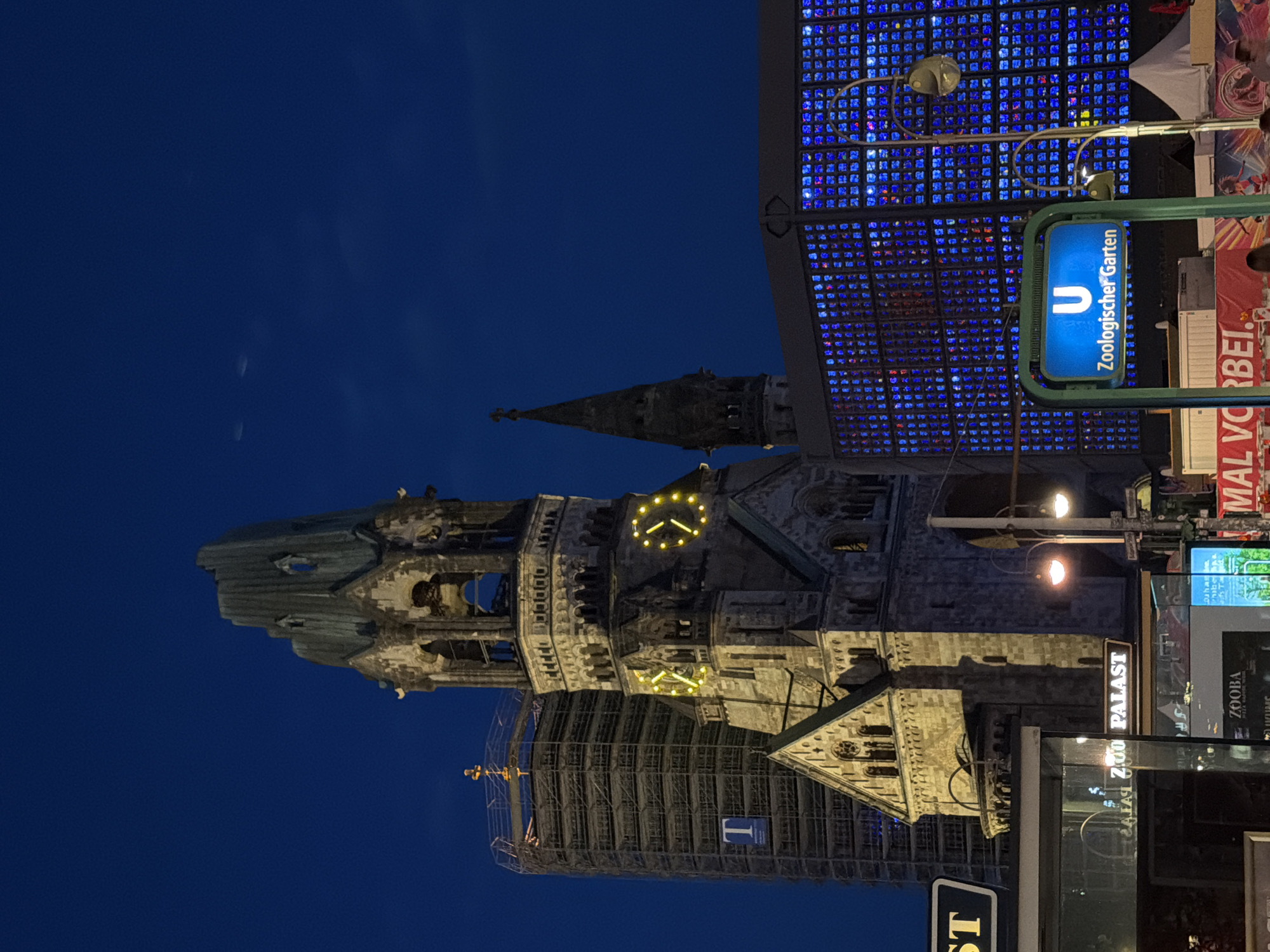 Berlin at night: memorial church ruins meet glowing modern towers