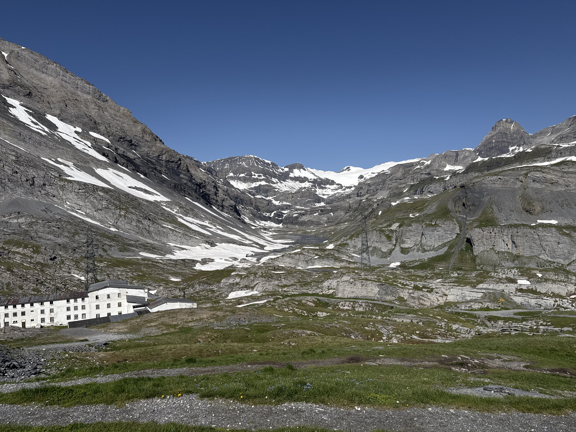 Alpine building complex at the foot of Leukerbad's rocky cliffs