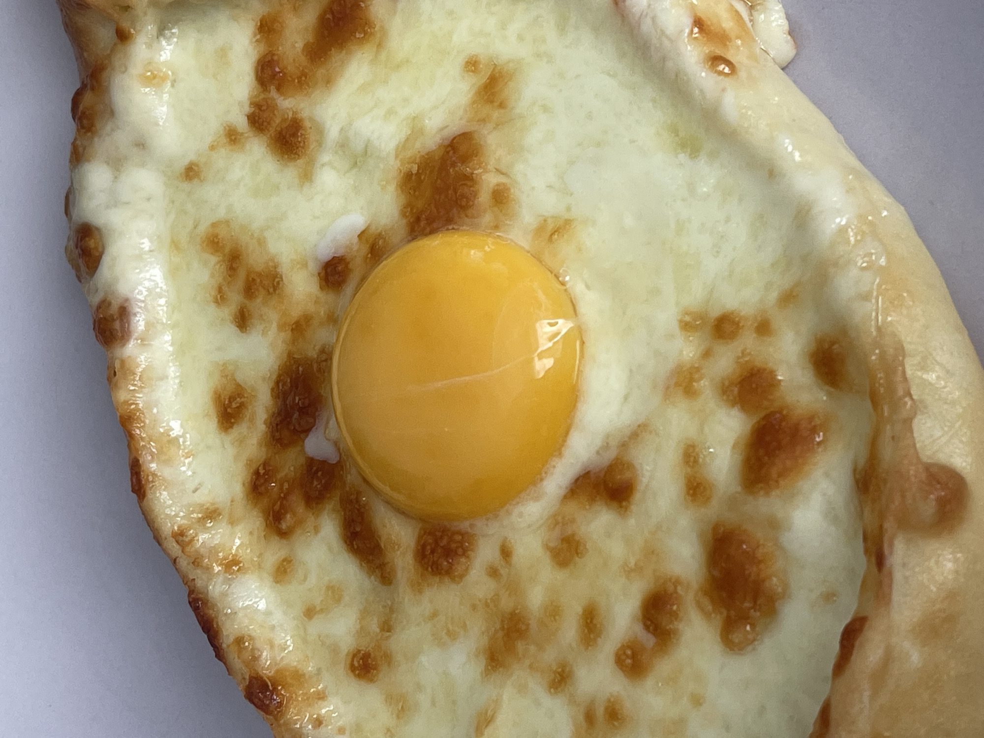Close-up overhead look at a fresh khachapuri in Orenburg