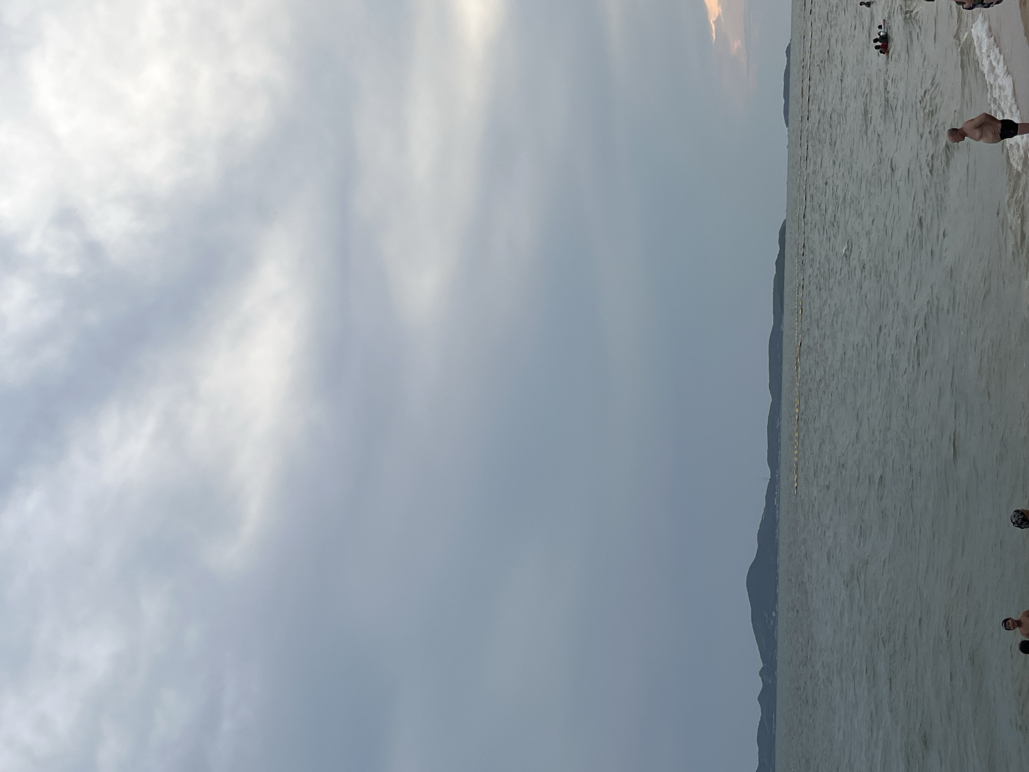 Tourist activities continue at Pattaya beach under cloudy skies