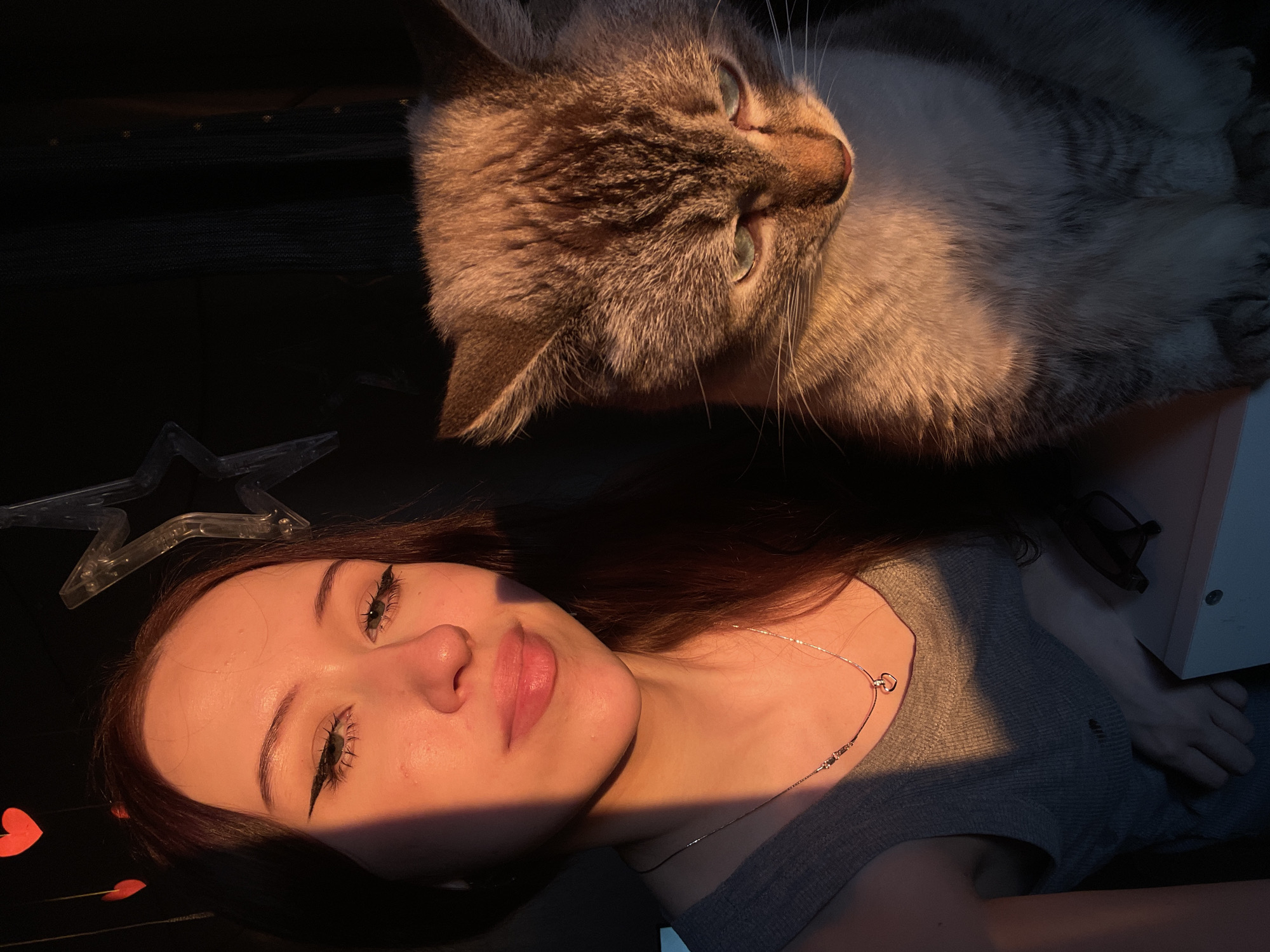 Woman documents bedroom selfie session with cat in Votkinsk