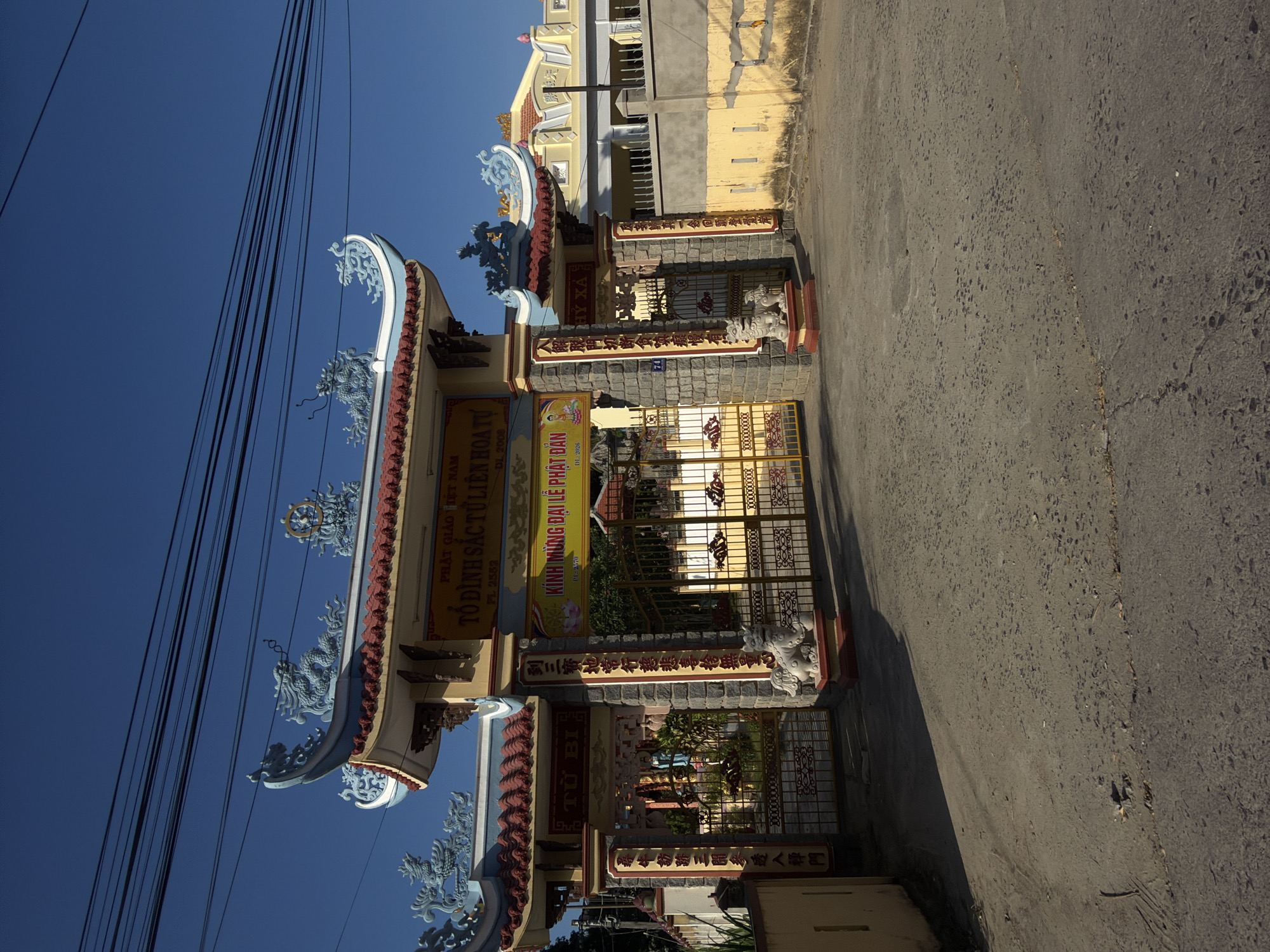 Temple gate and a PS5 delivery, Nha Trang streets