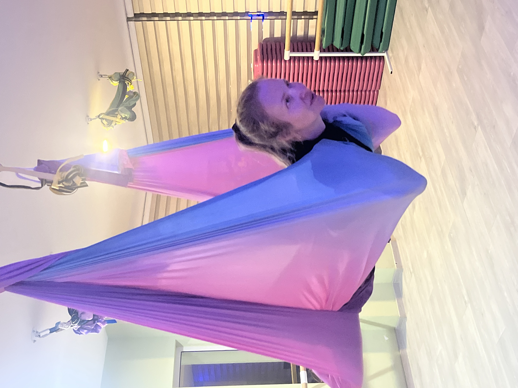 Aerial yoga session in a Budva studio, hammocks and all