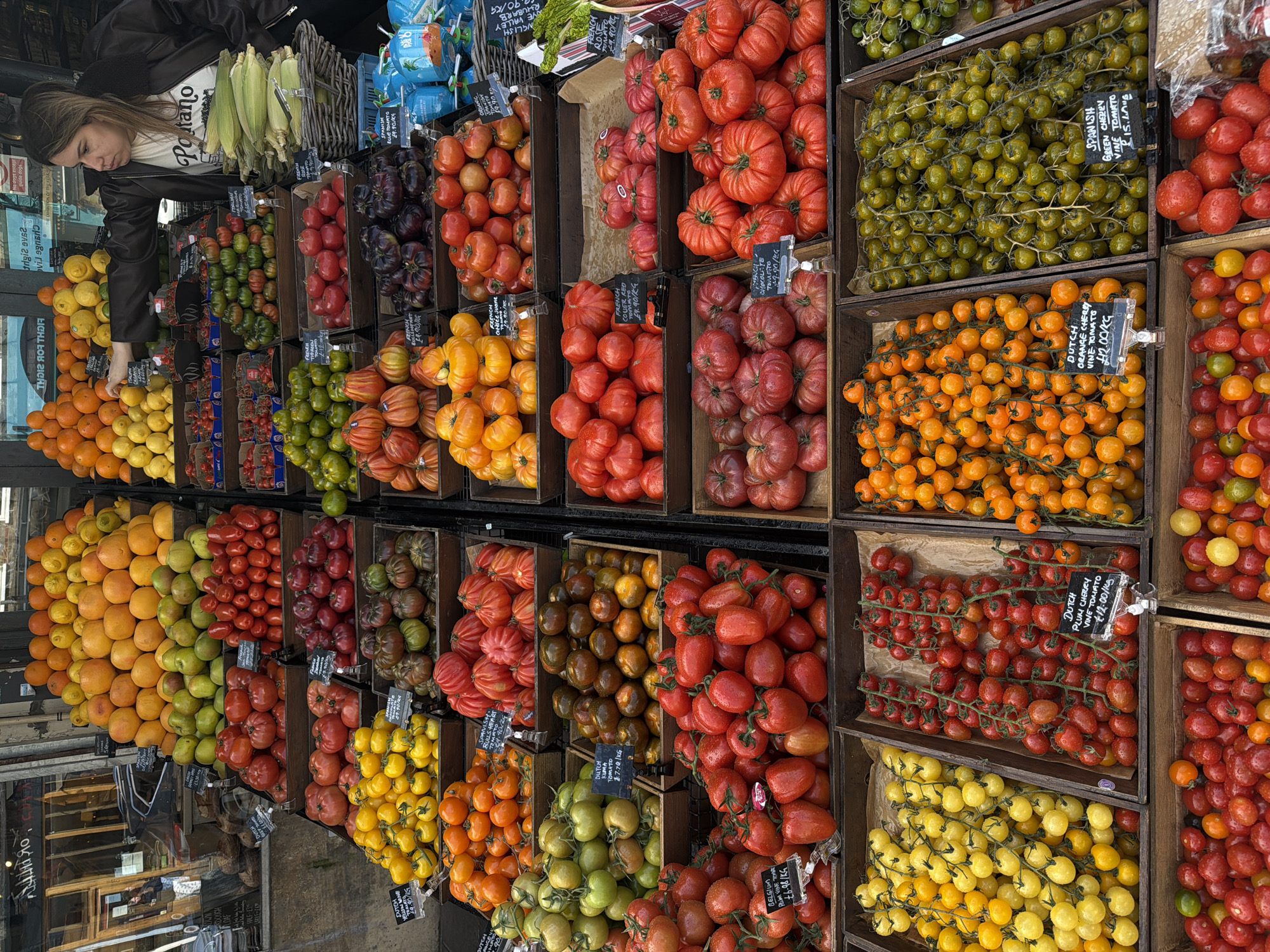 London market vendor displays variety of fresh produce