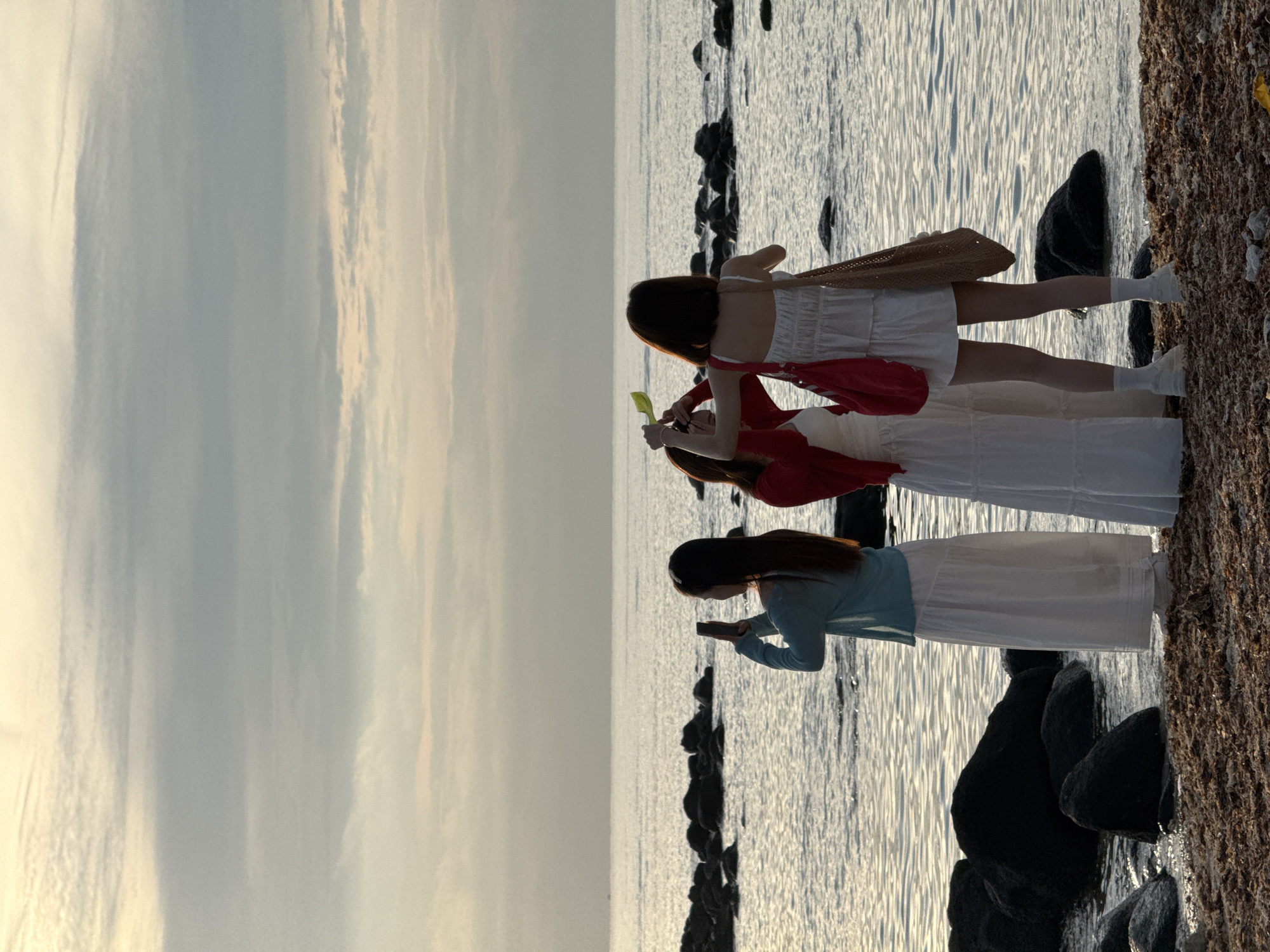 Sunset silhouettes on the rocky shores of Lý Sơn Island