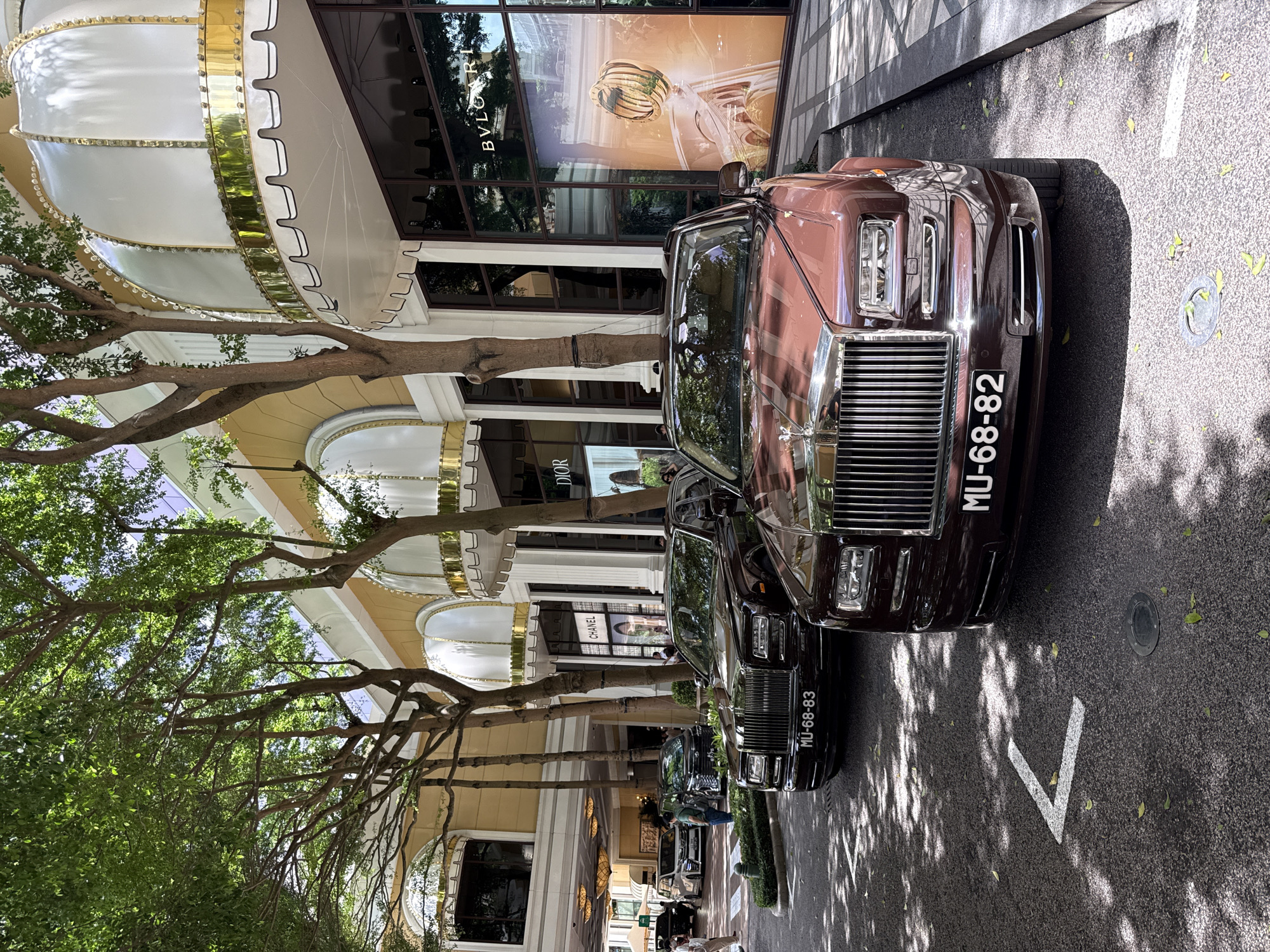 Street-level tour of Macau's Grand Lisboa strip with luxury cars