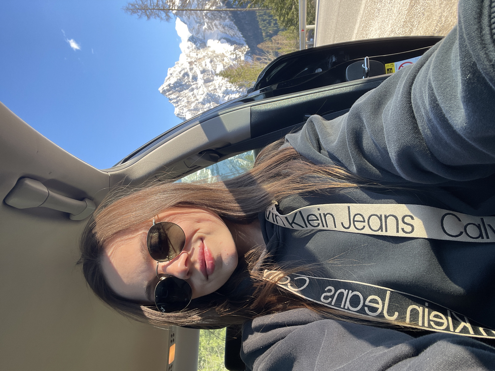 Woman documents Dolomites road trip with selfies in Italy