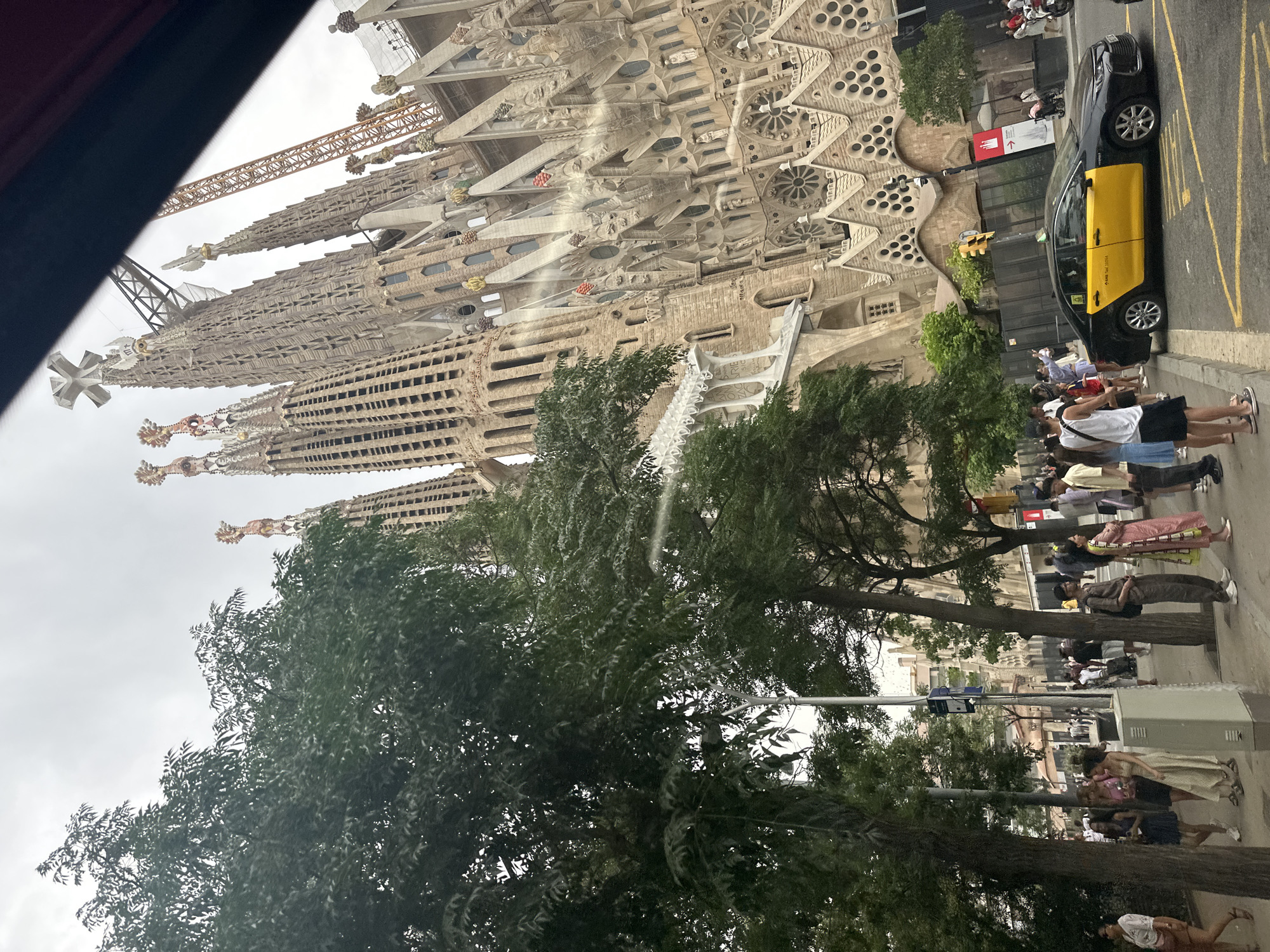 Sagrada Família street view with construction crane visible