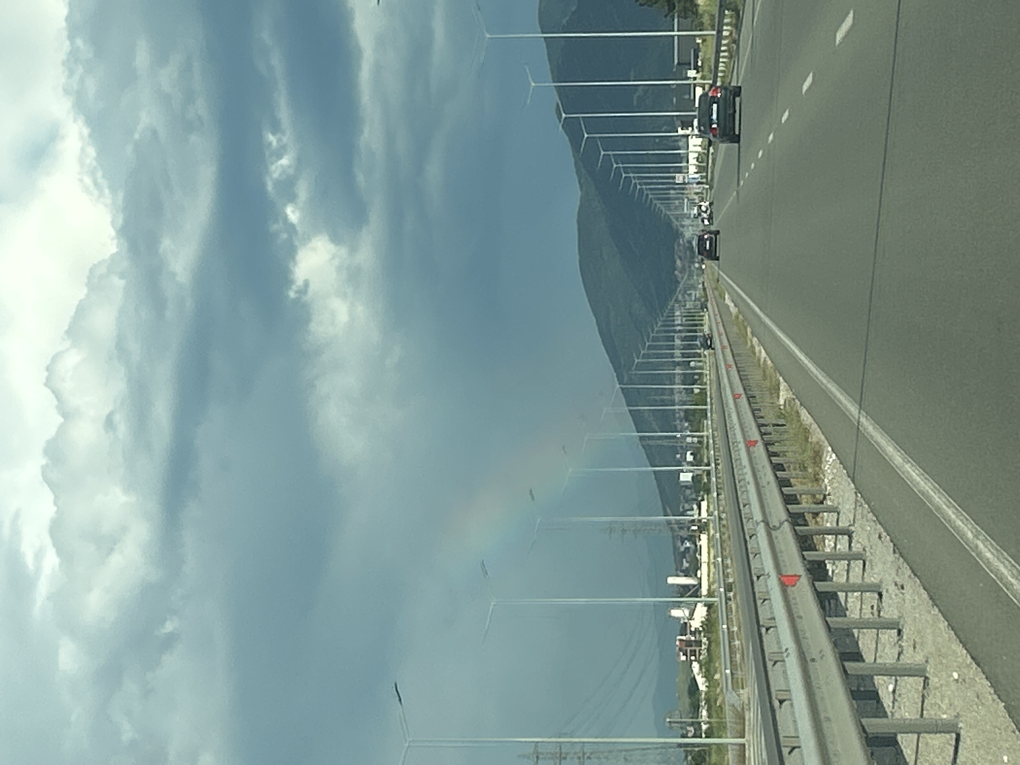 Highway drive past mountains captured in vehicle dashcam sequence