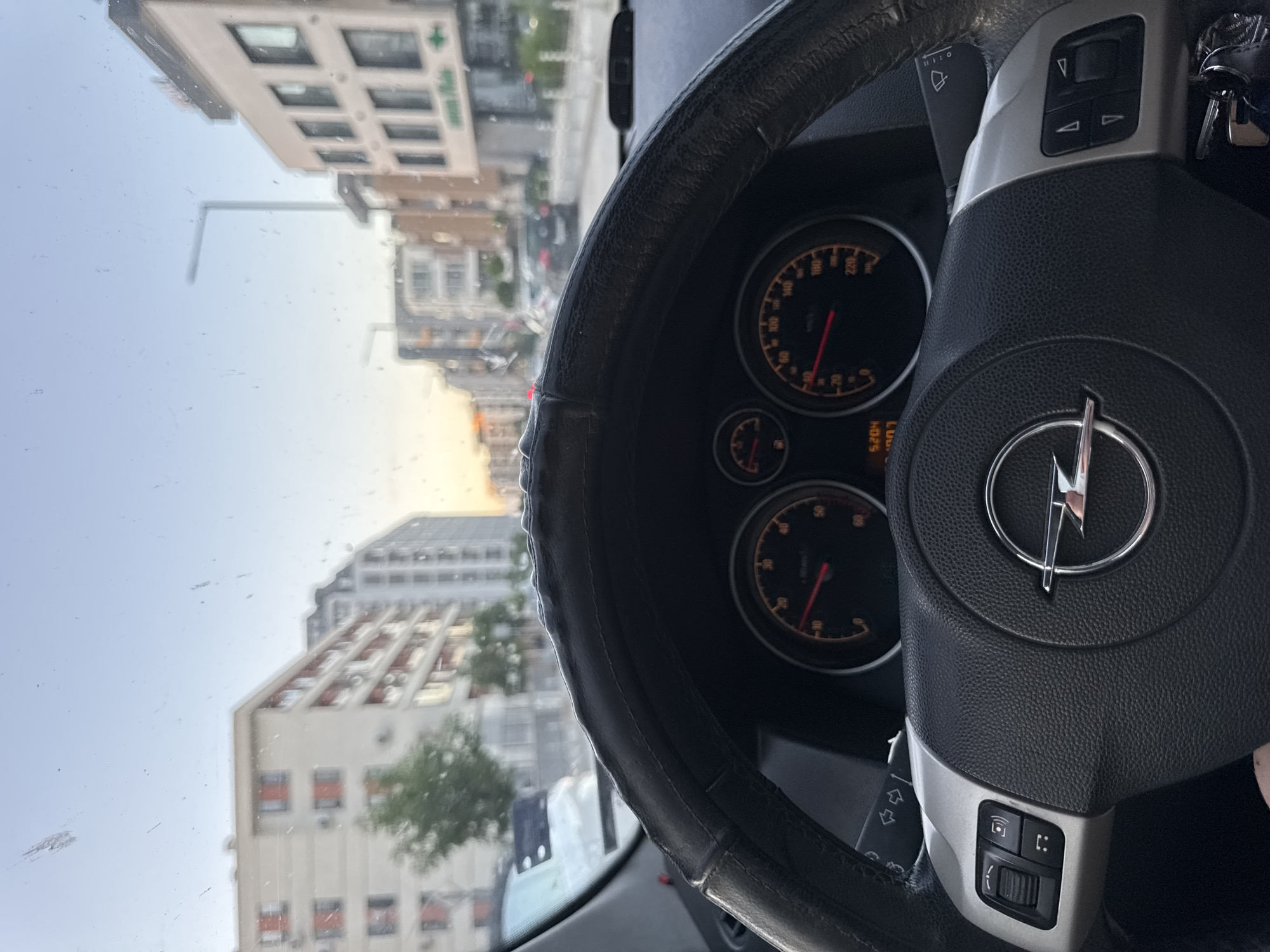 Driver navigates Sofia streets at low speed during evening commute