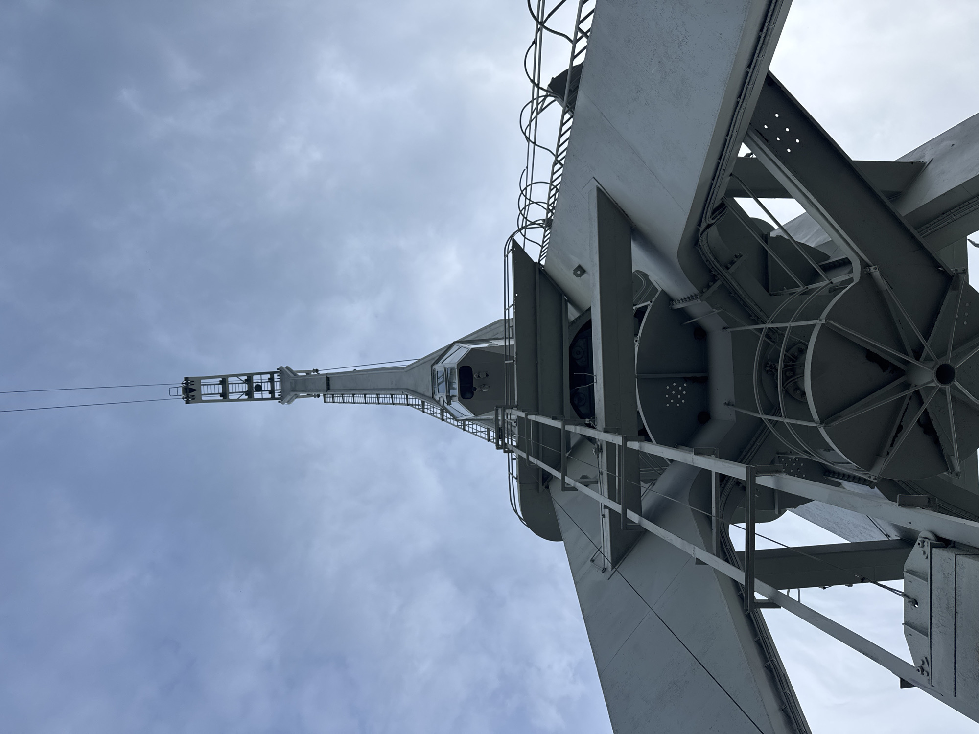 Burgas port: military vessel, gantry cranes, and calm bay views