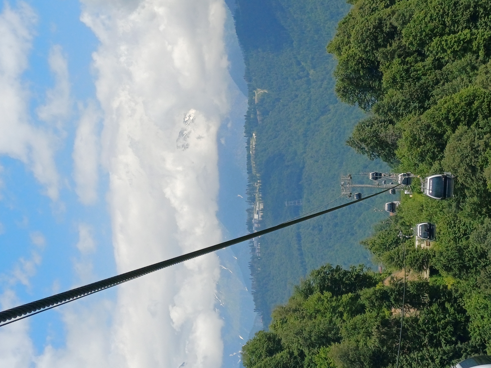 Summer cable car views over forested mountains in Estosadok, Russia