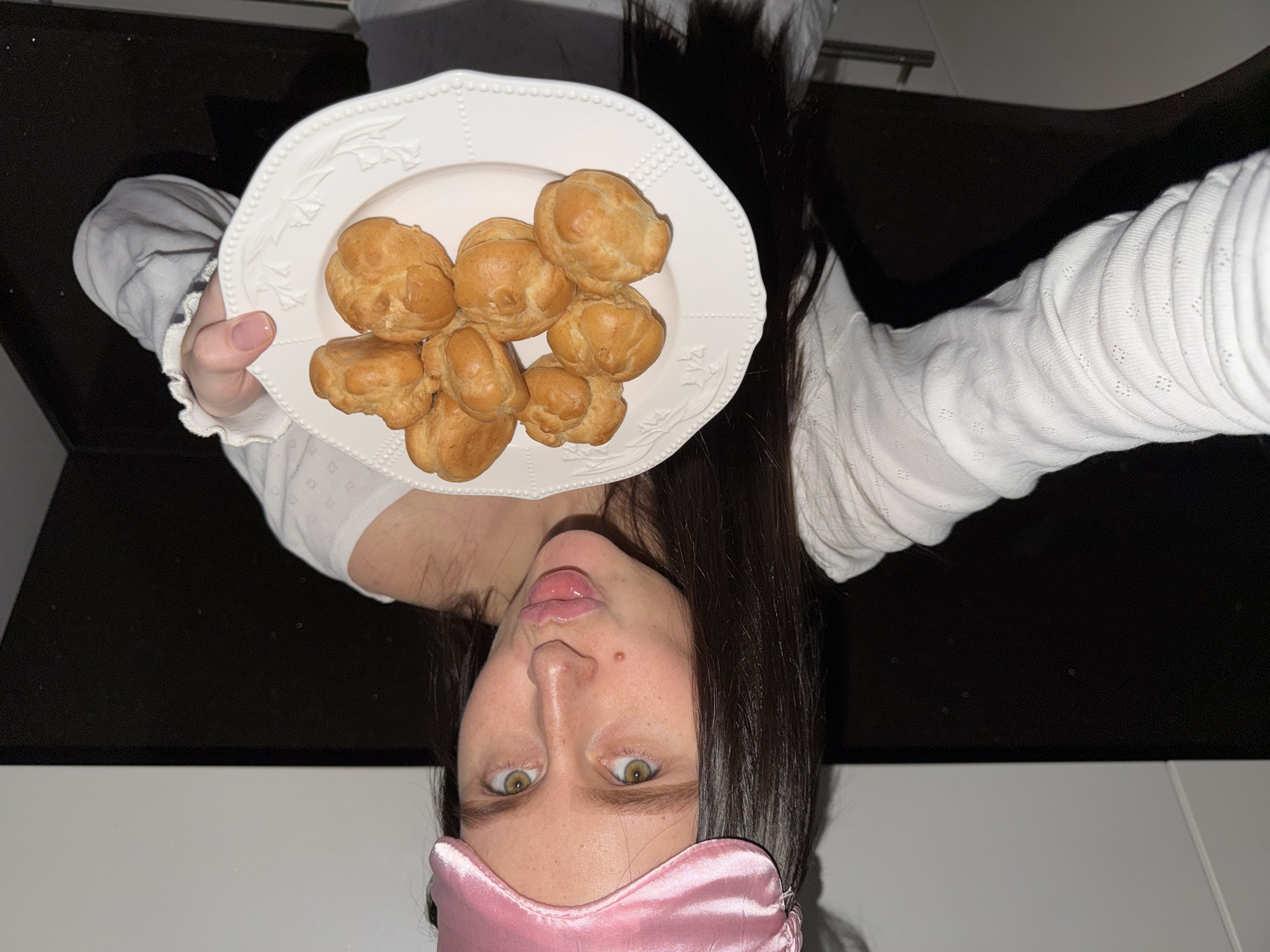 Woman poses with pastries in playful photo session, Khimki