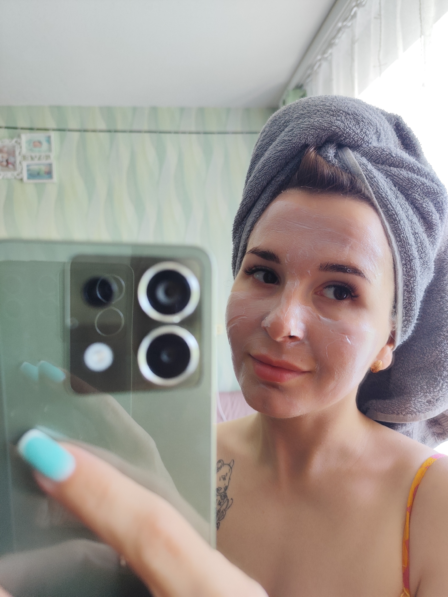 Woman takes masked selfies during morning skincare routine in Russia