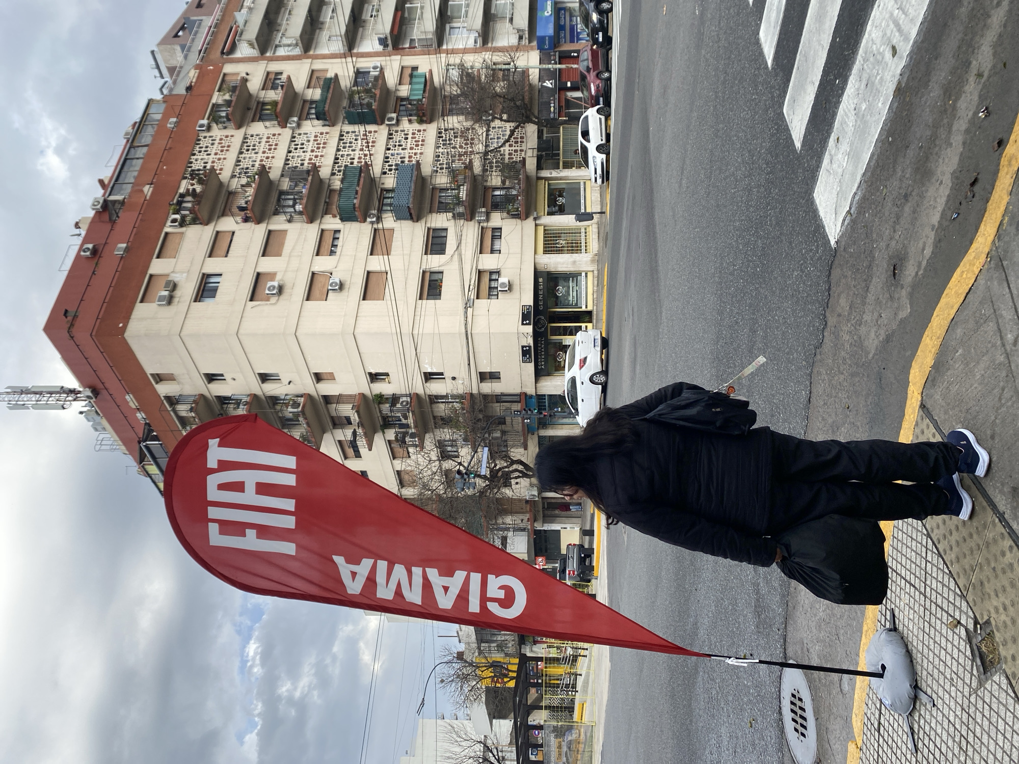 Person spotted on checkered sidewalk in Buenos Aires