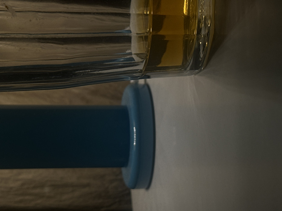 Glass with amber liquid observed in dim Suginami interior
