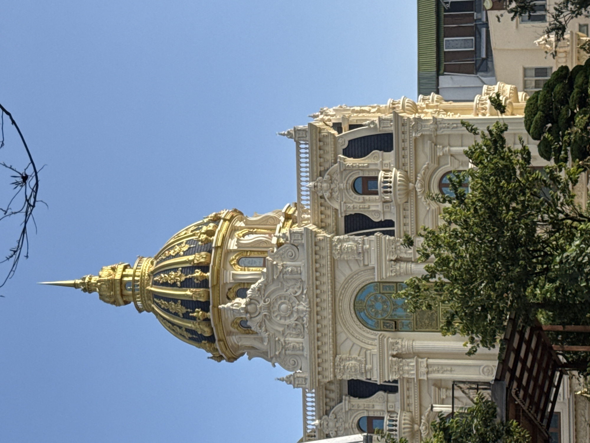 Da Lat's ornate golden dome building, street life nearby