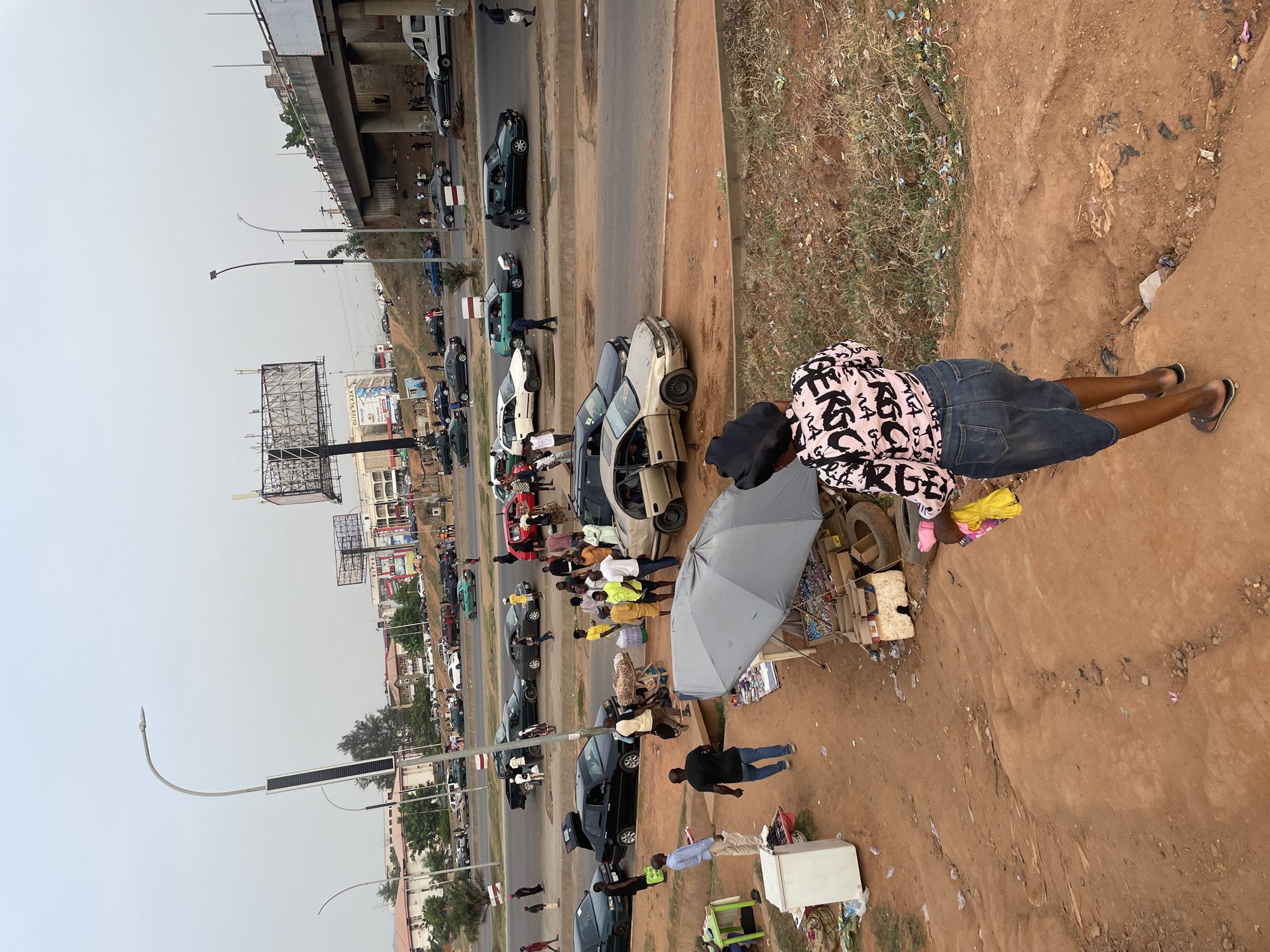 Hazy afternoon street scene documented in Abuja, Nigeria