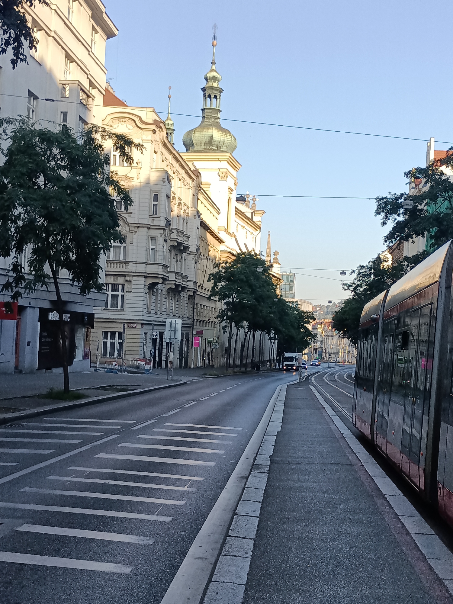 Prague tram corridor caught in low-angle morning or evening light
