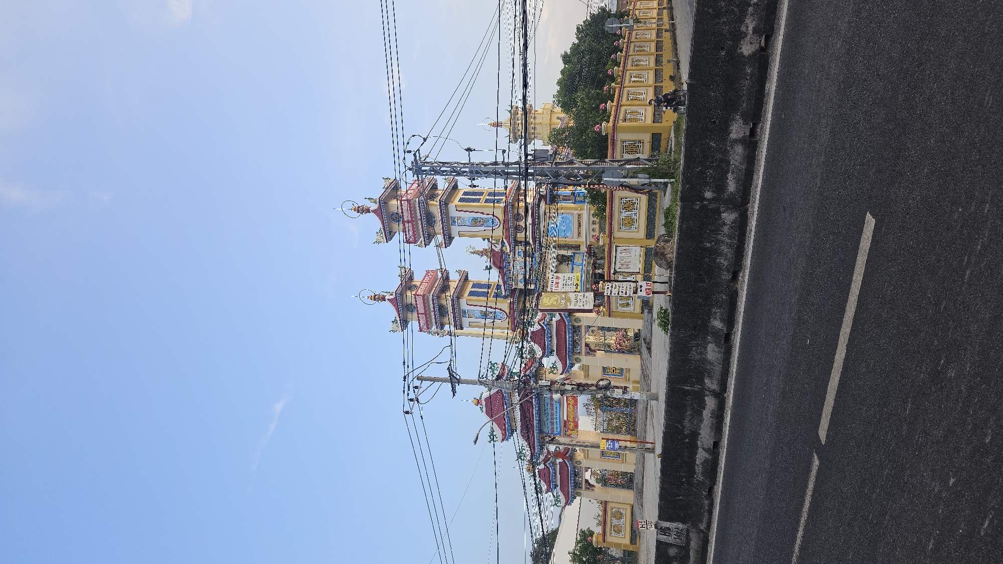 Colorful pagodas documented alongside roadway in Cam Đức, Vietnam