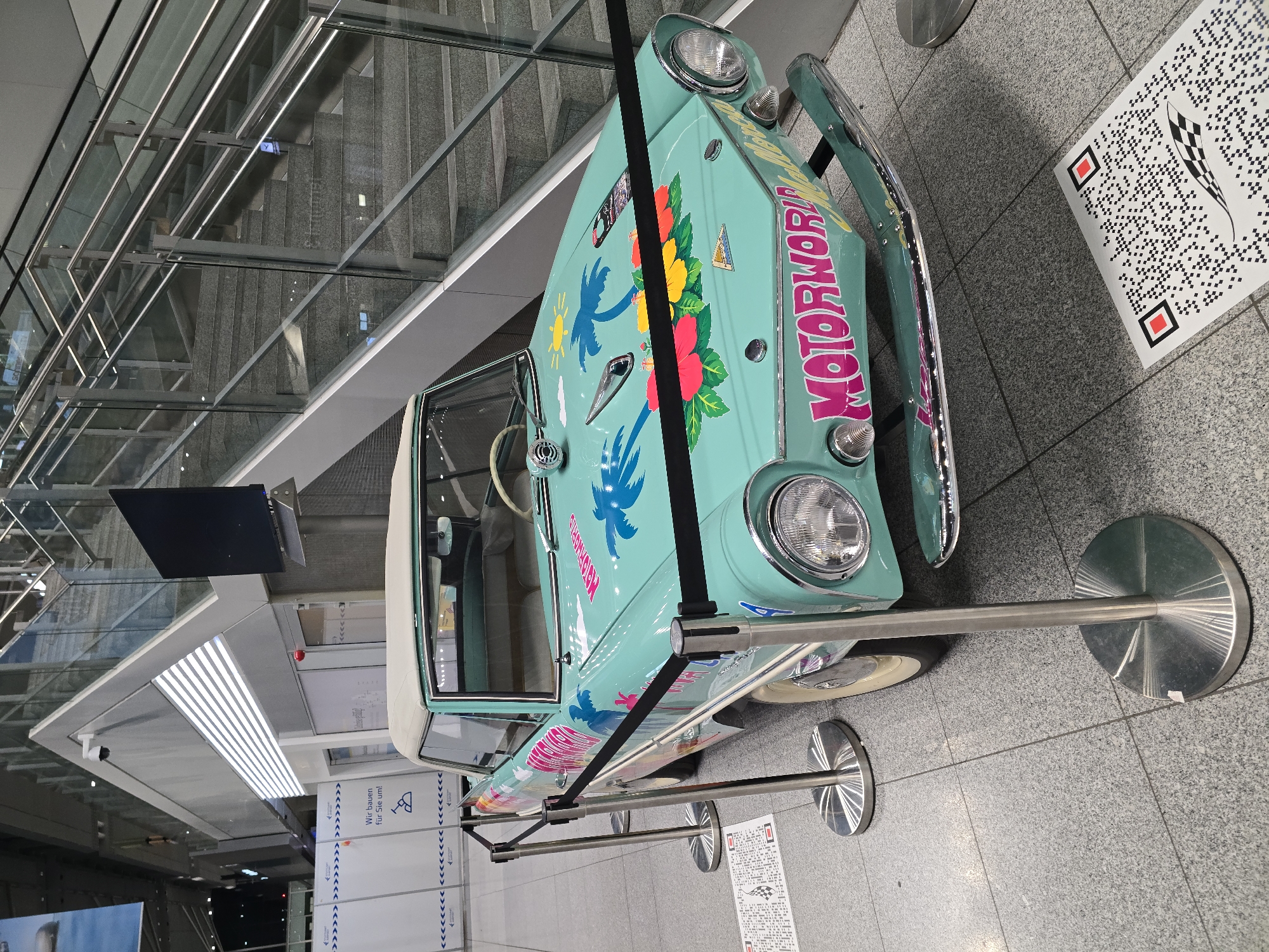 Tropical-themed vintage amphibious car on display in Stuttgart terminal