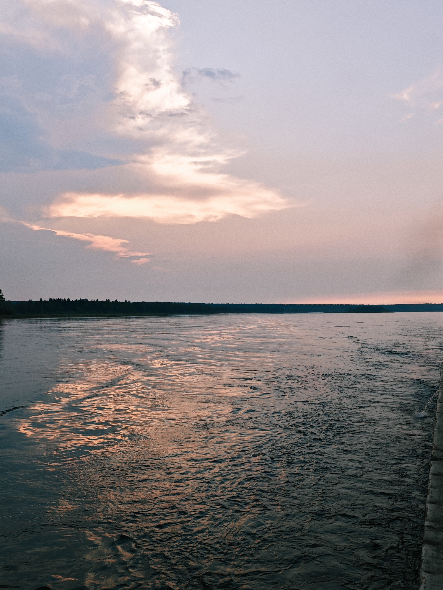 Drifting down a Siberian river at twilight