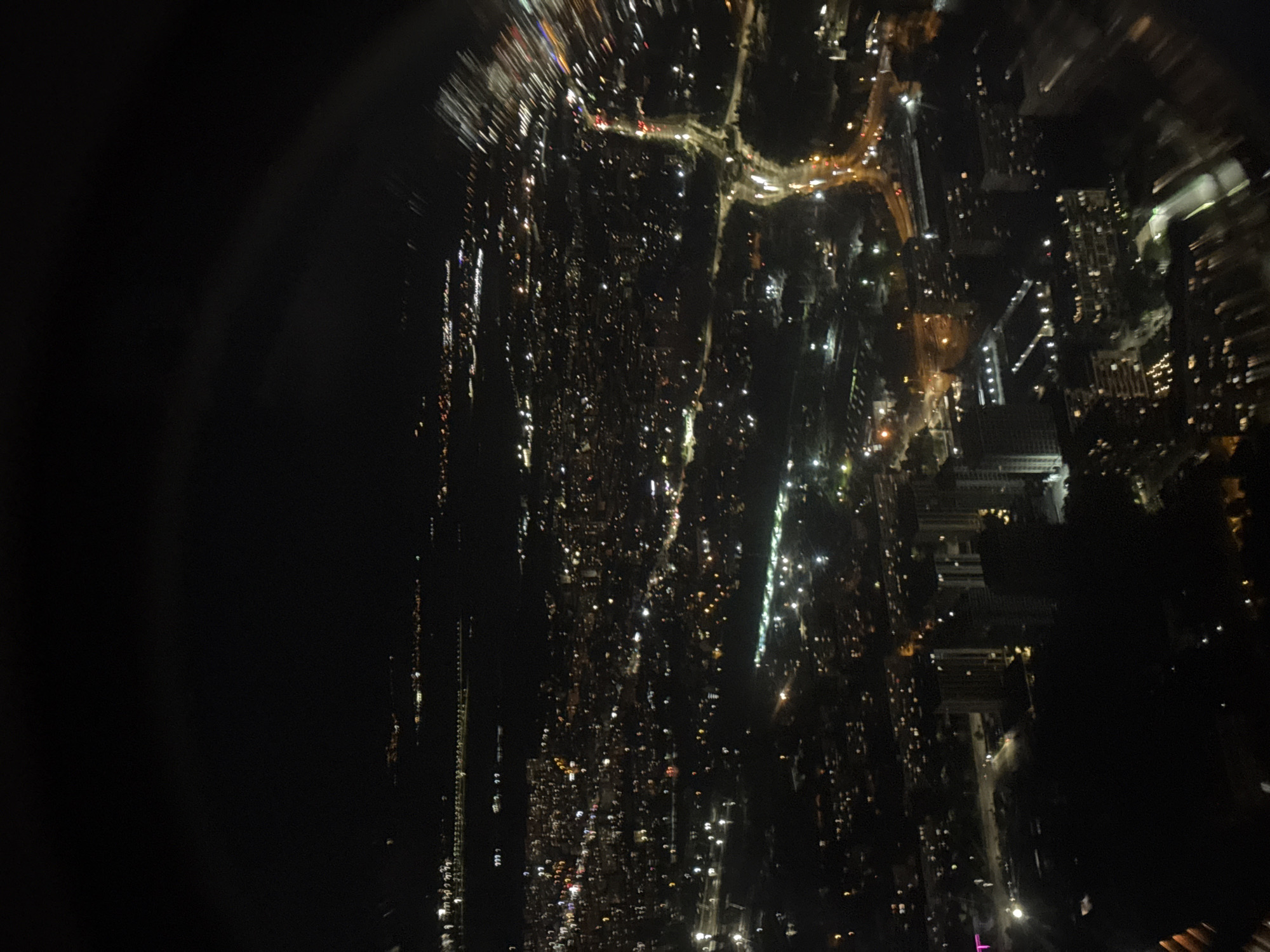 Sofia at night, seen from above through blurred city lights.