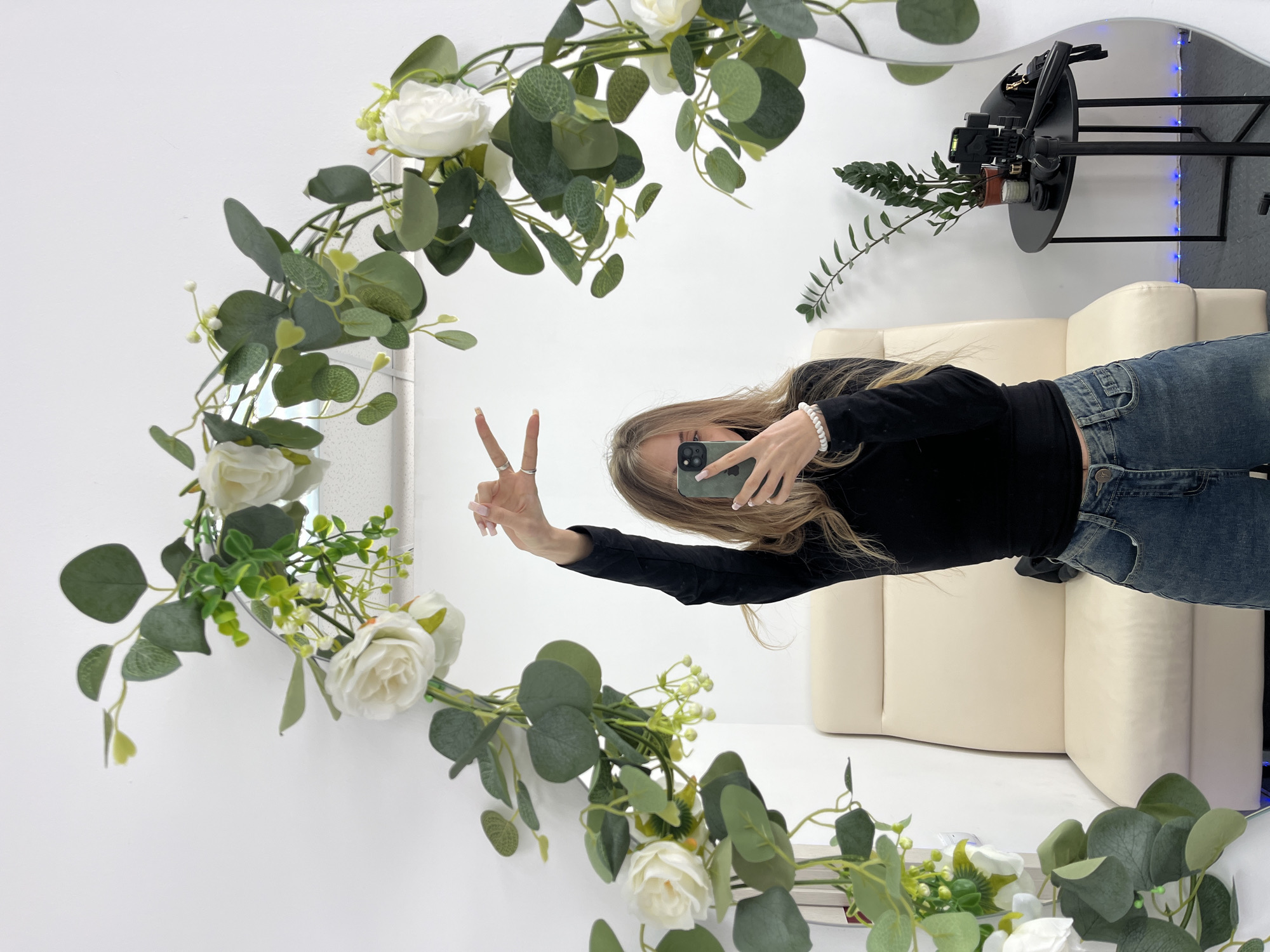 Young woman takes morning selfies at Russian nail salon