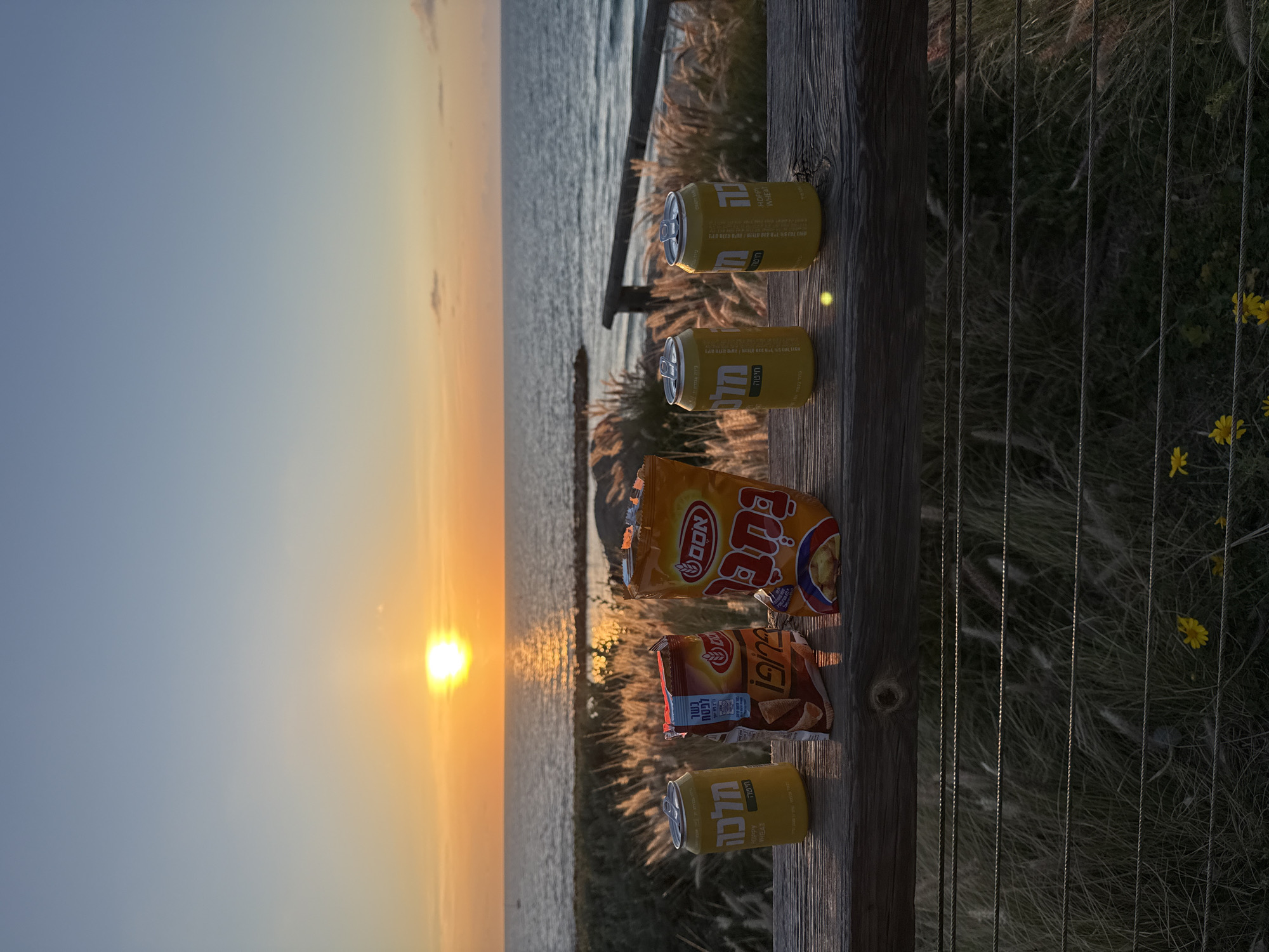 Sunset beer moment captured at Tel Aviv scenic overlook