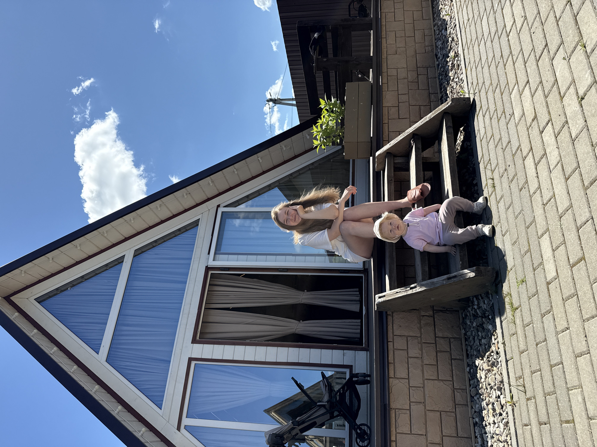 Family playtime captured in sunny Suzdal backyard