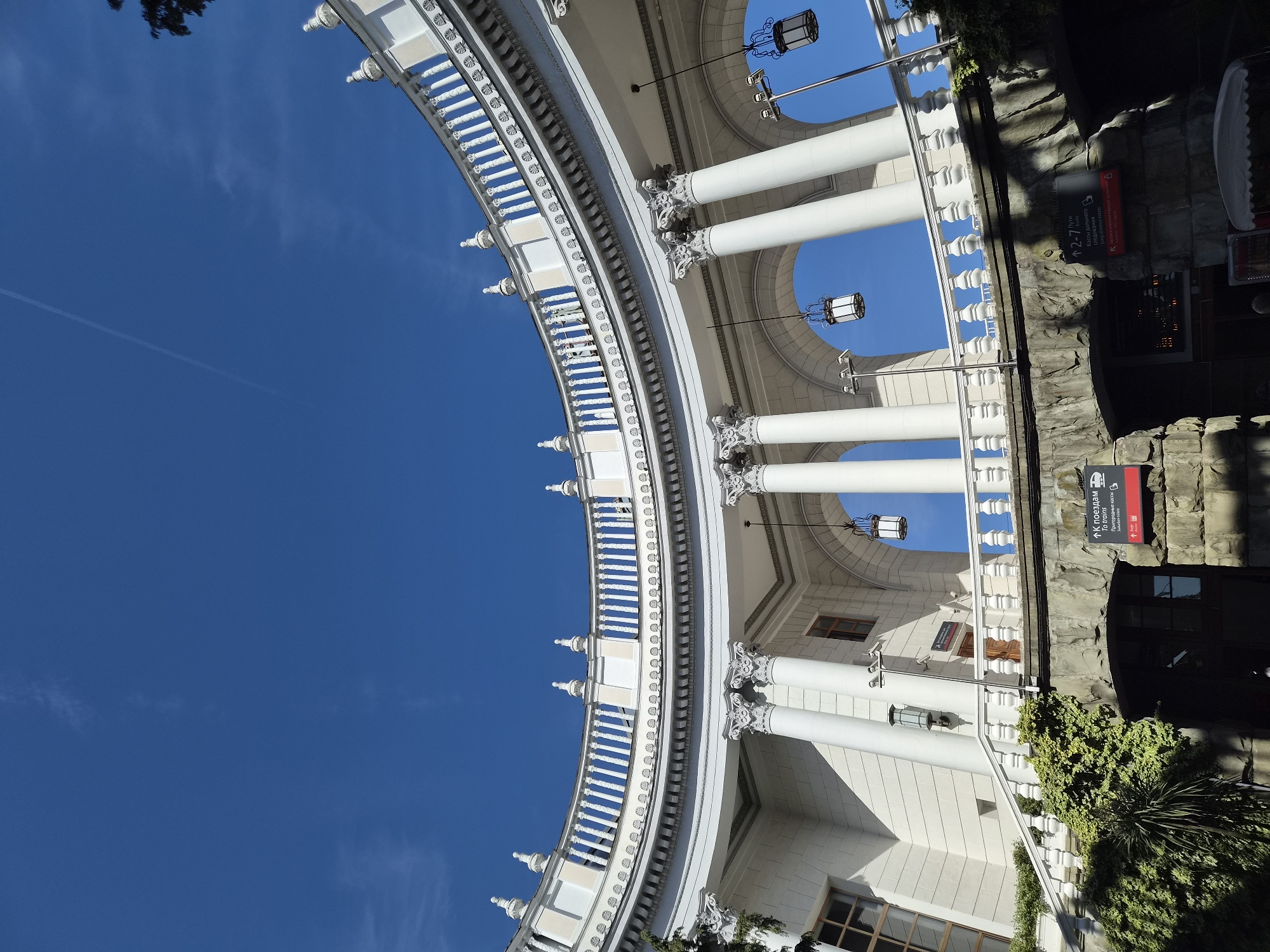 Visitor documents Sochi Railway Station architecture in upward views