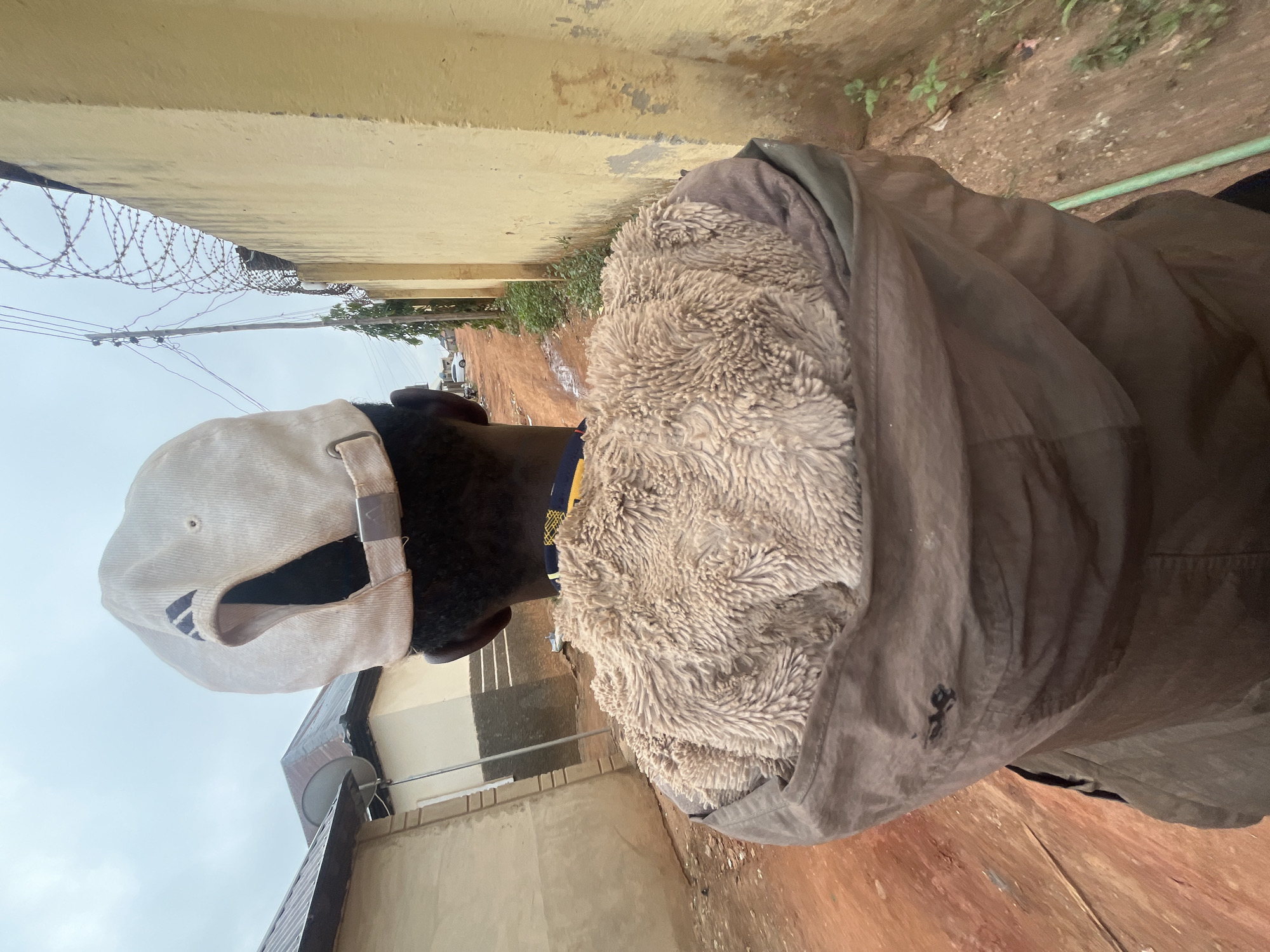 Person in brown jacket observed in Galadimawa alleyway