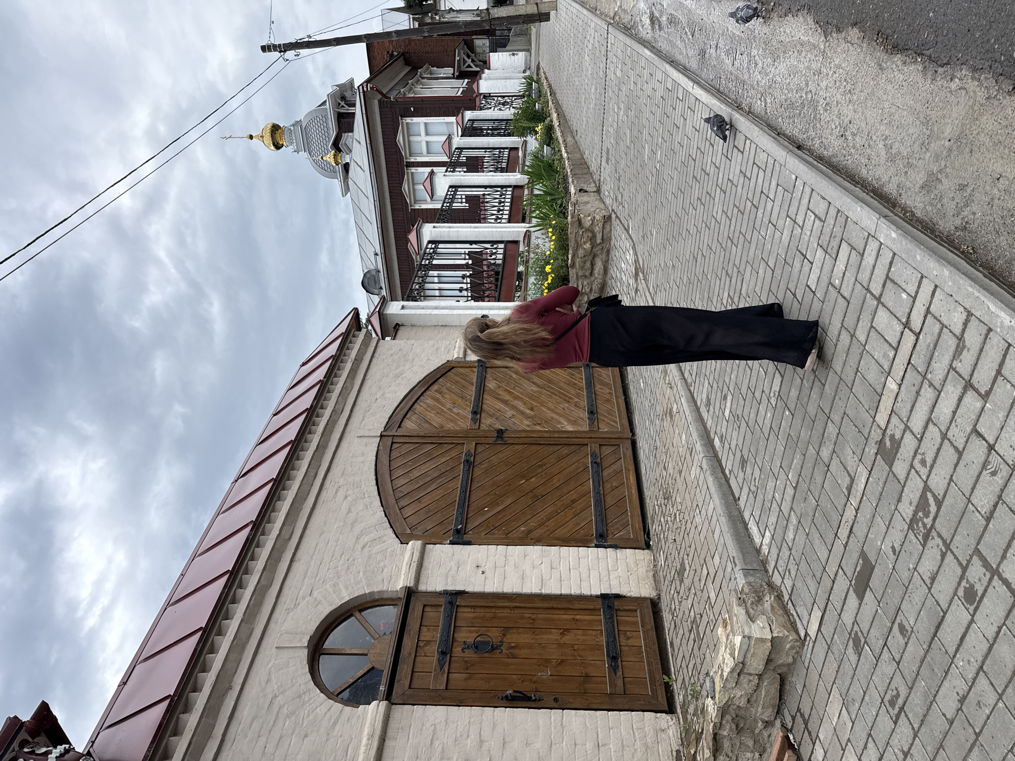 Pedestrians Navigate Izhevsk Streets on Overcast June Afternoon