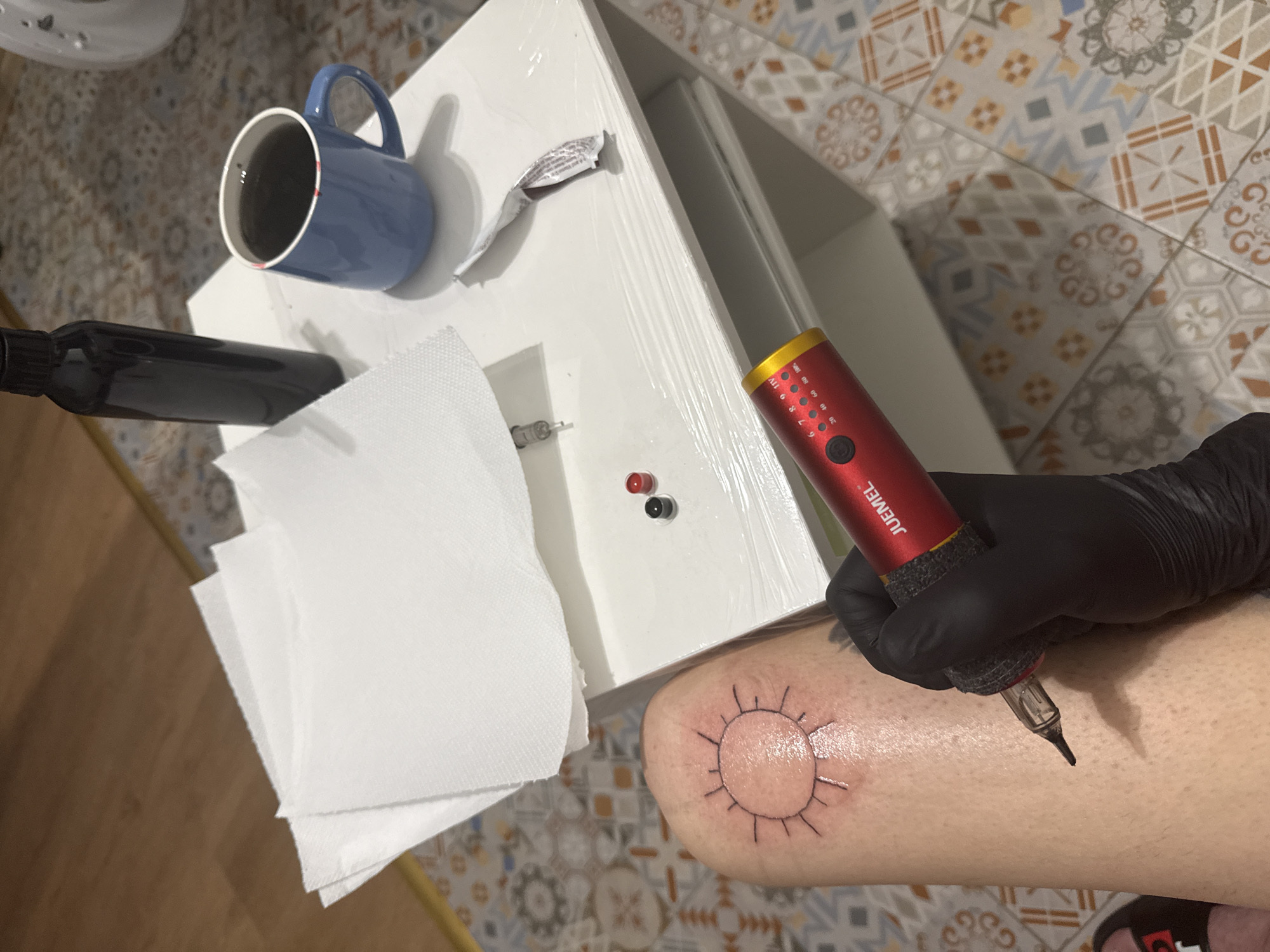 Tattoo session documented in Sofia evening cityscape