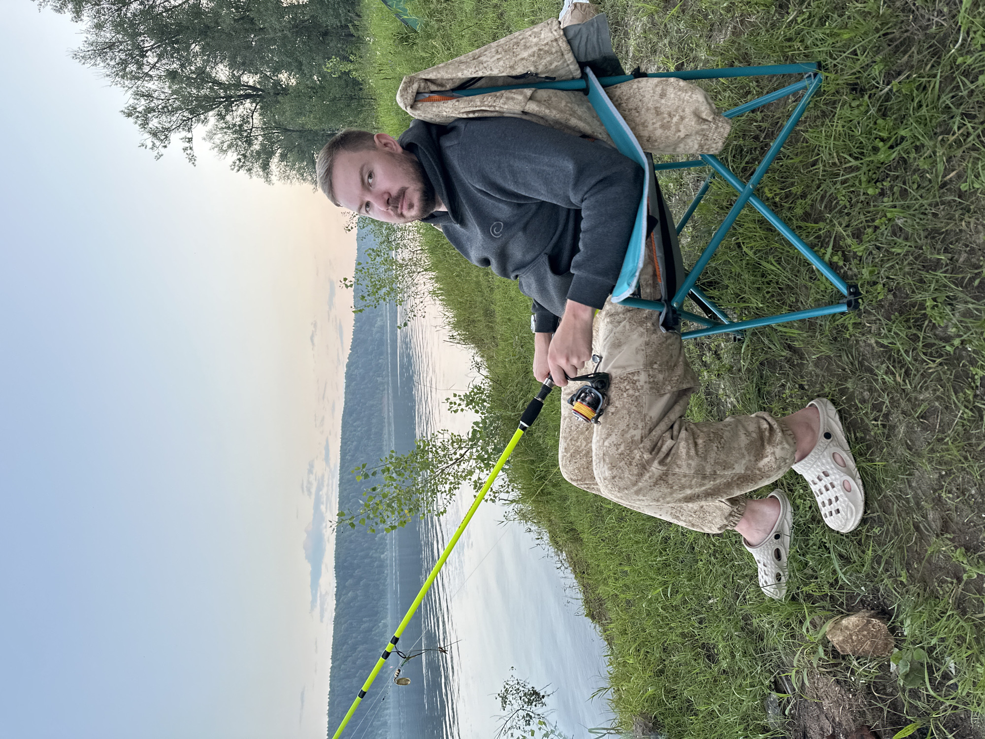 Lazy summer fishing and camping on a Russian riverbank