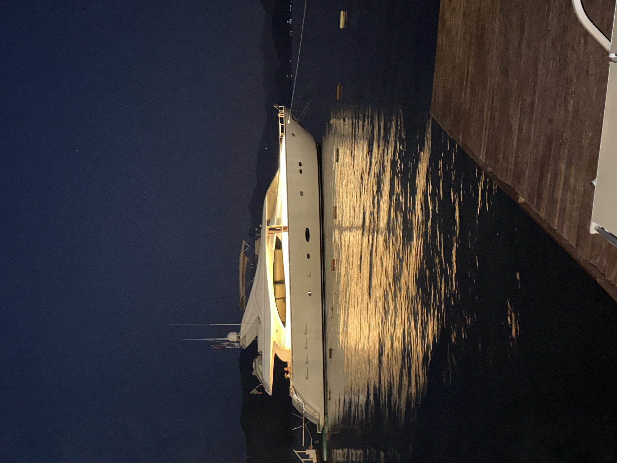 White yacht moored in Marmaris harbor on a calm night