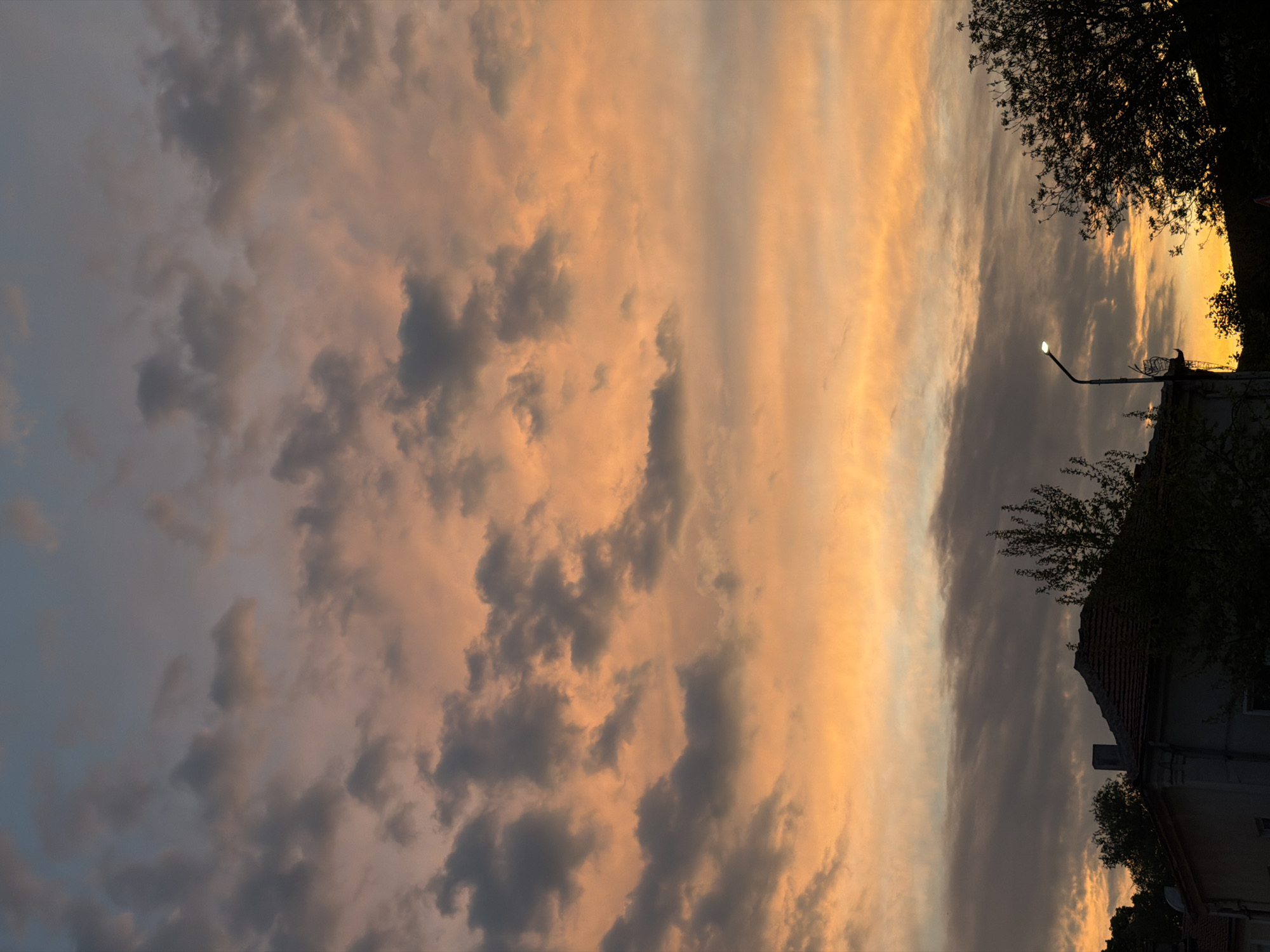 Sunset observed over Lovech, Bulgaria with orange-gray clouds