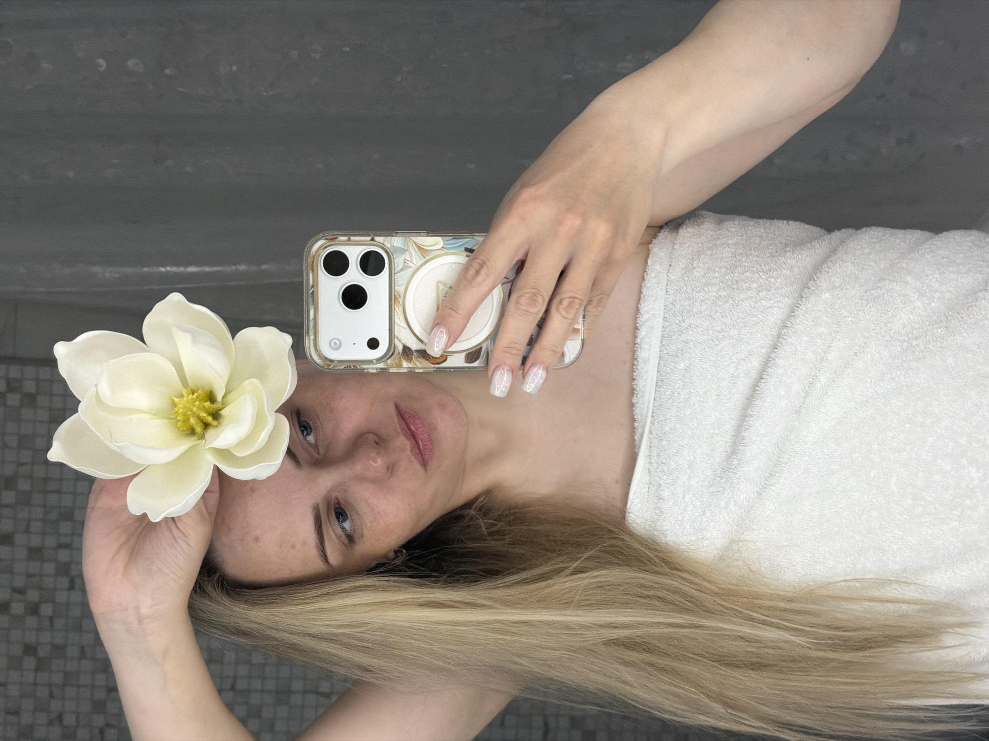Woman takes bathroom mirror selfies in Votkinsk, Russia