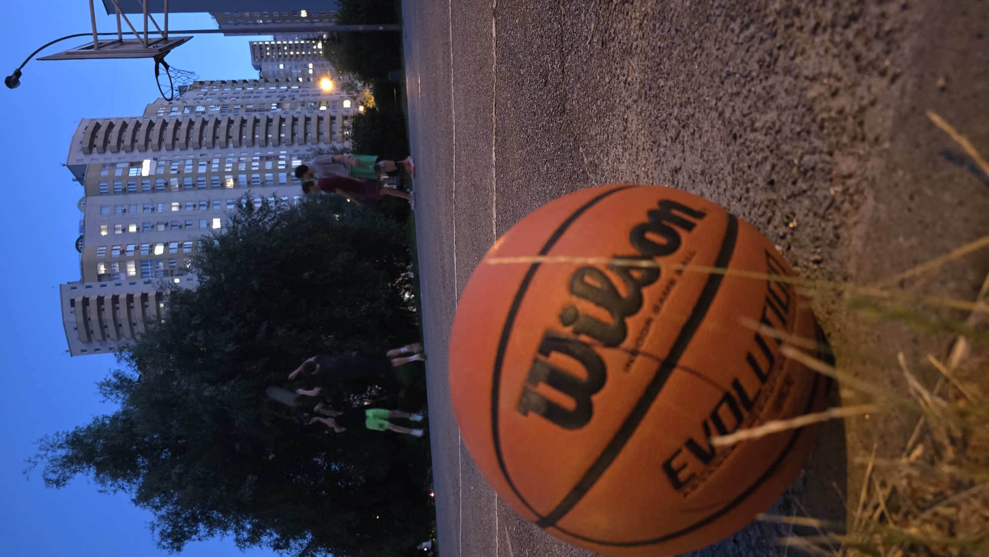 Summer evening sports and hangouts in a Kyiv residential neighborhood