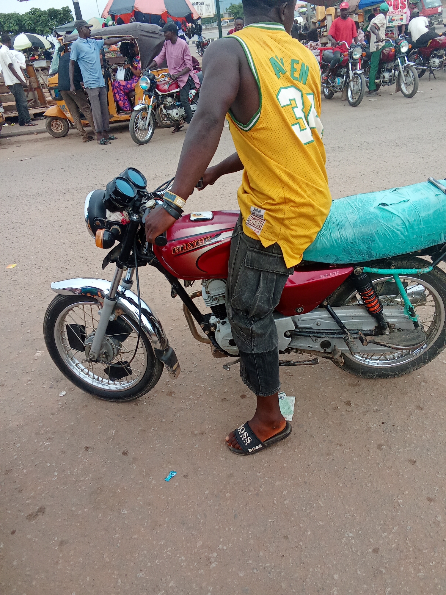 Motorcycle taxis and keke napeps fill the streets of Kubwa and Kagini