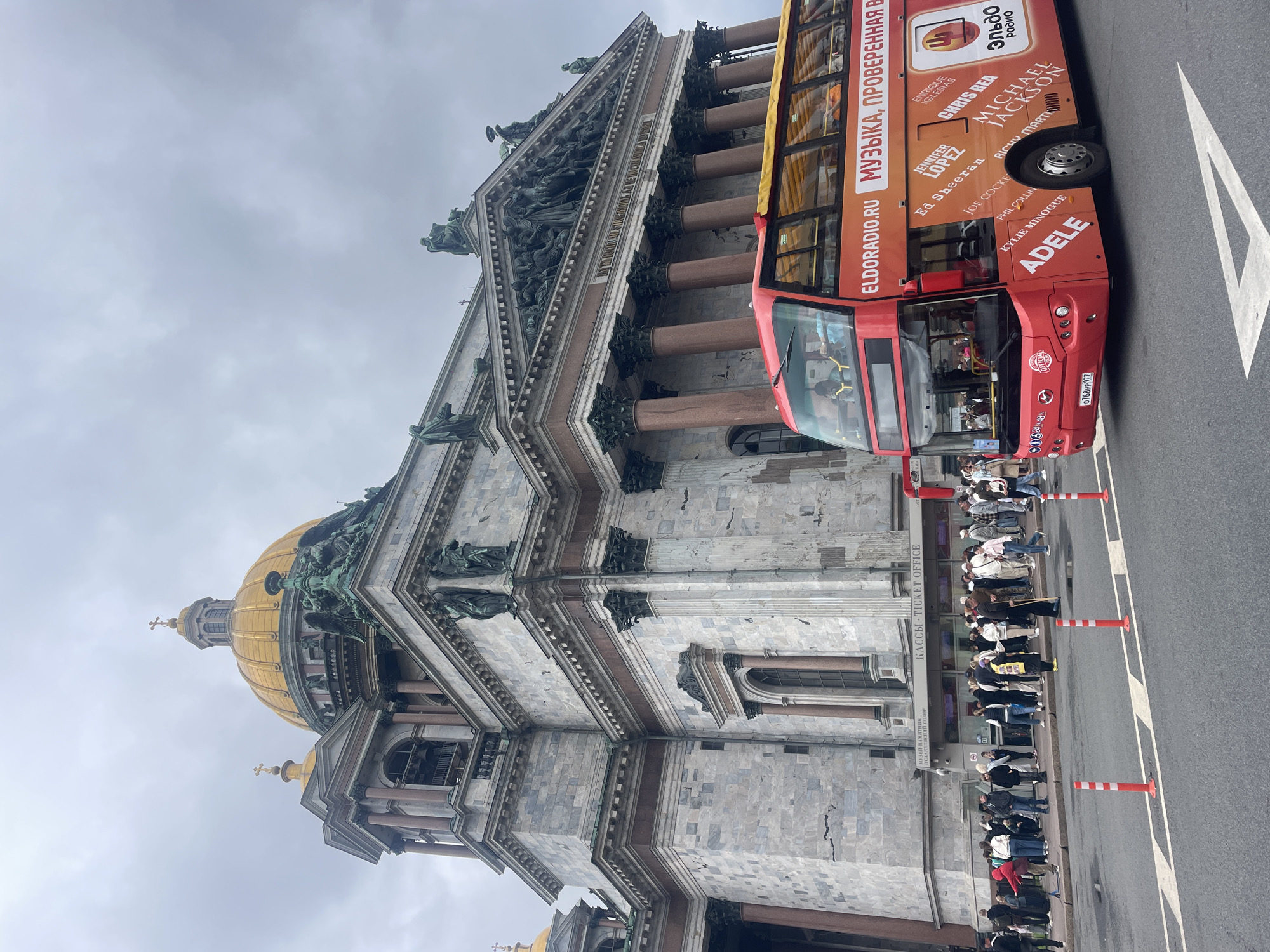 Street life around St. Isaac's Cathedral on a cloudy St. Petersburg morning