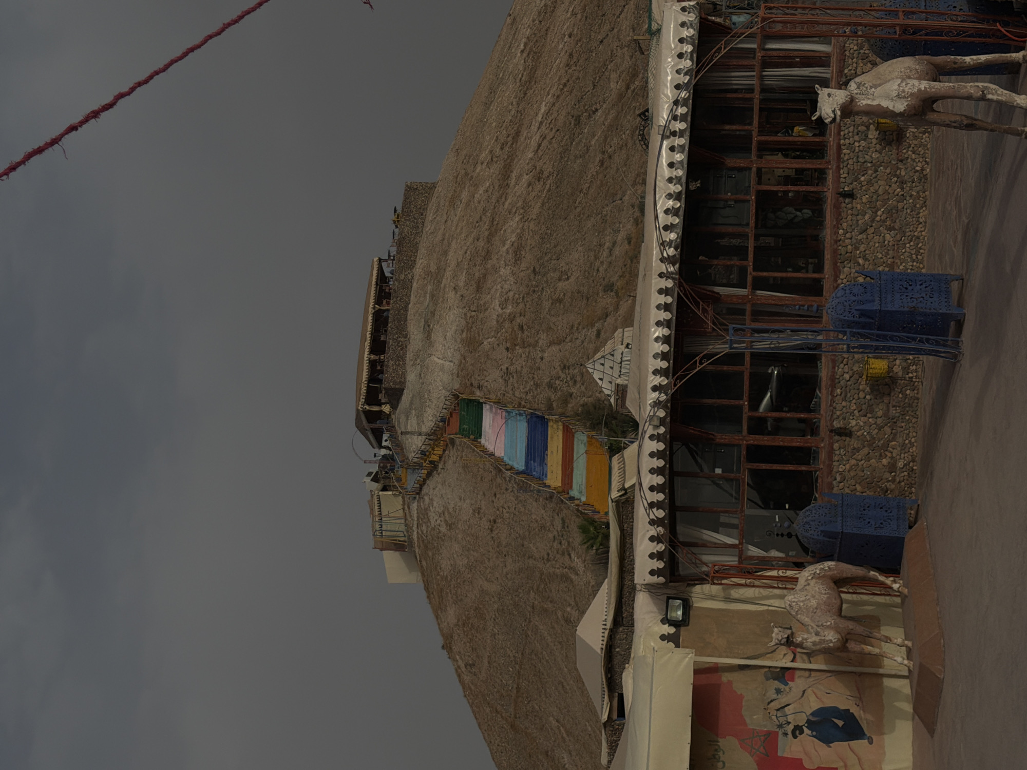 Colorful staircase and hilltop structure in Agafay desert, Morocco
