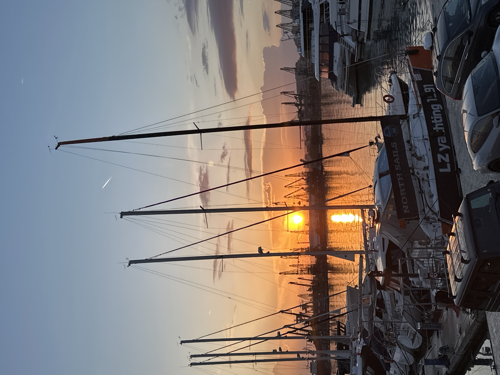 Sunset captured at Varna marina with boats and luxury cars
