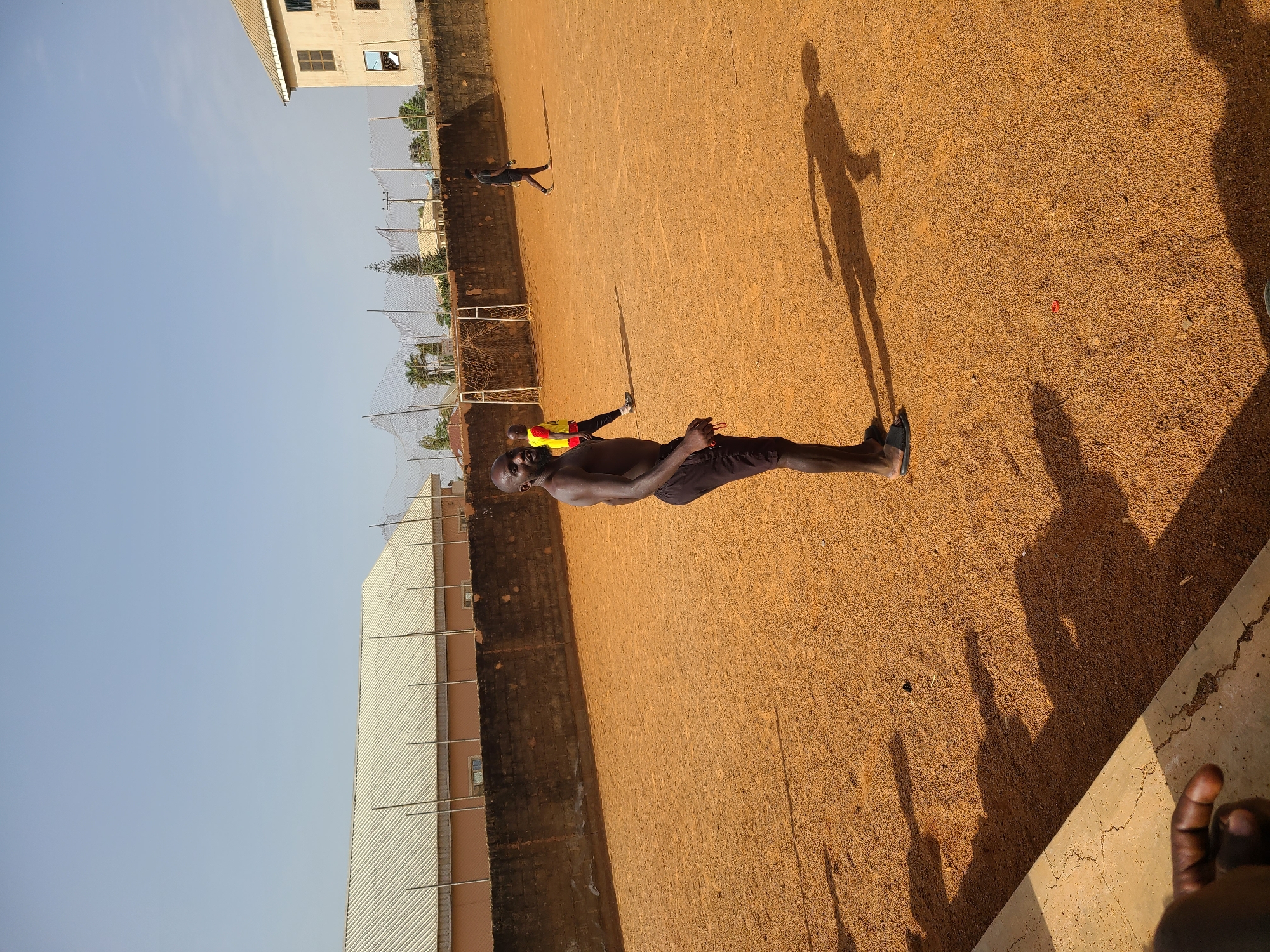Morning soccer games observed across Nigerian dirt fields