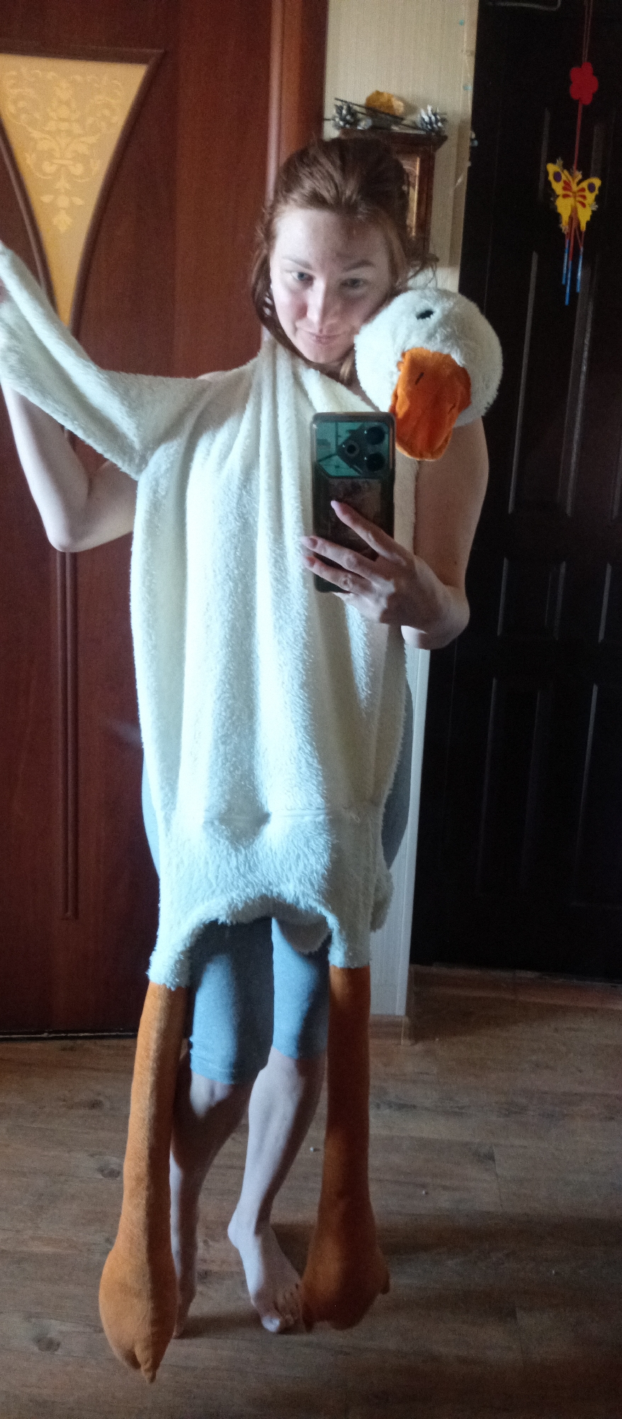 Person in goose costume makes green waffles indoors