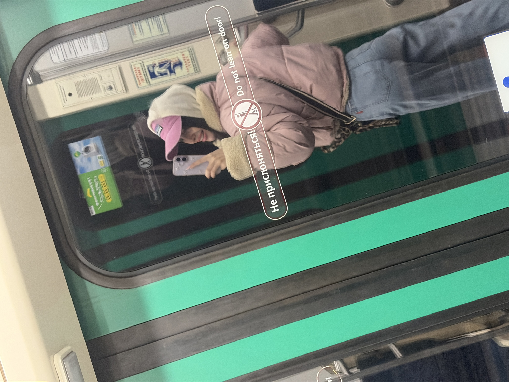 Woman Takes Selfies, Rests on Saint Petersburg Metro Train