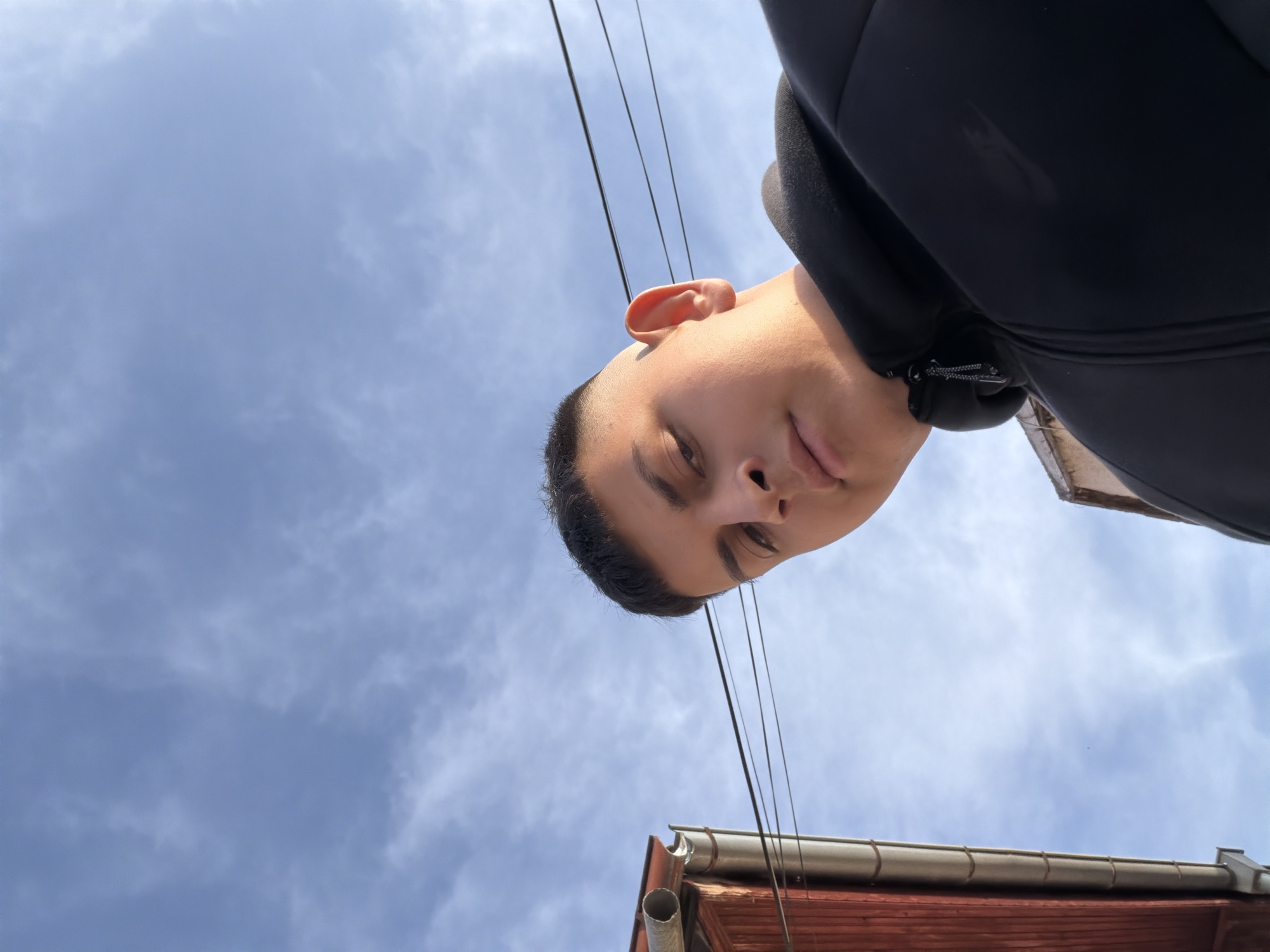 Young person photographed from below in Bulgarian town