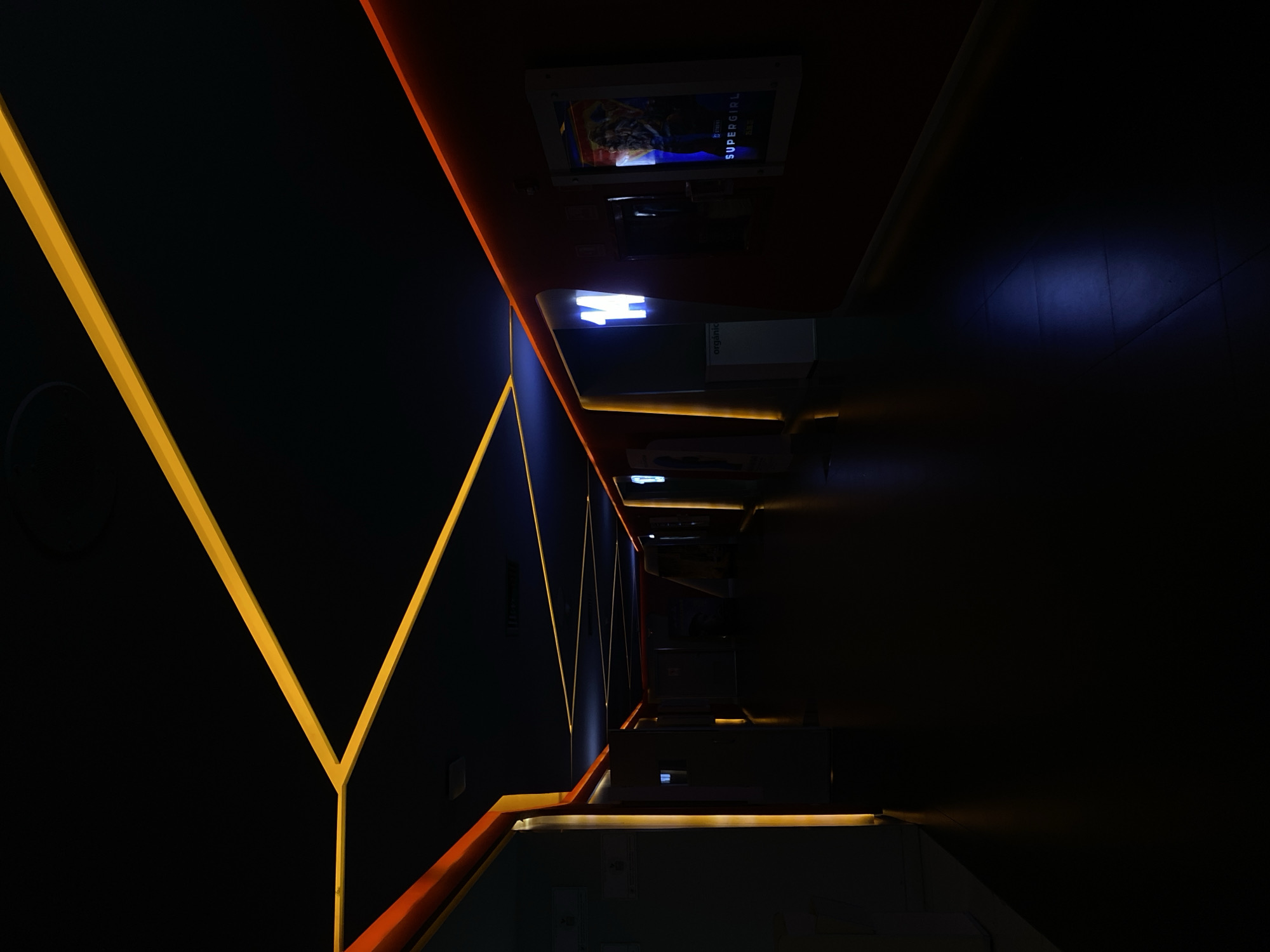 Modern corridor with bright yellow light strips documented