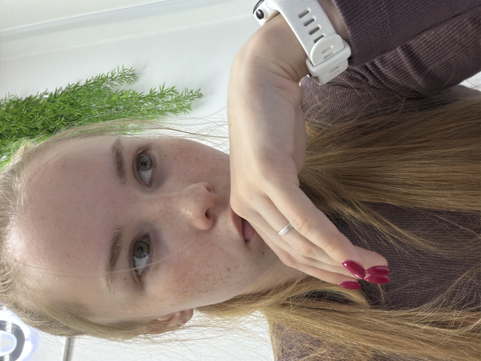 Woman takes selfies during laptop session in Usolye, Russia